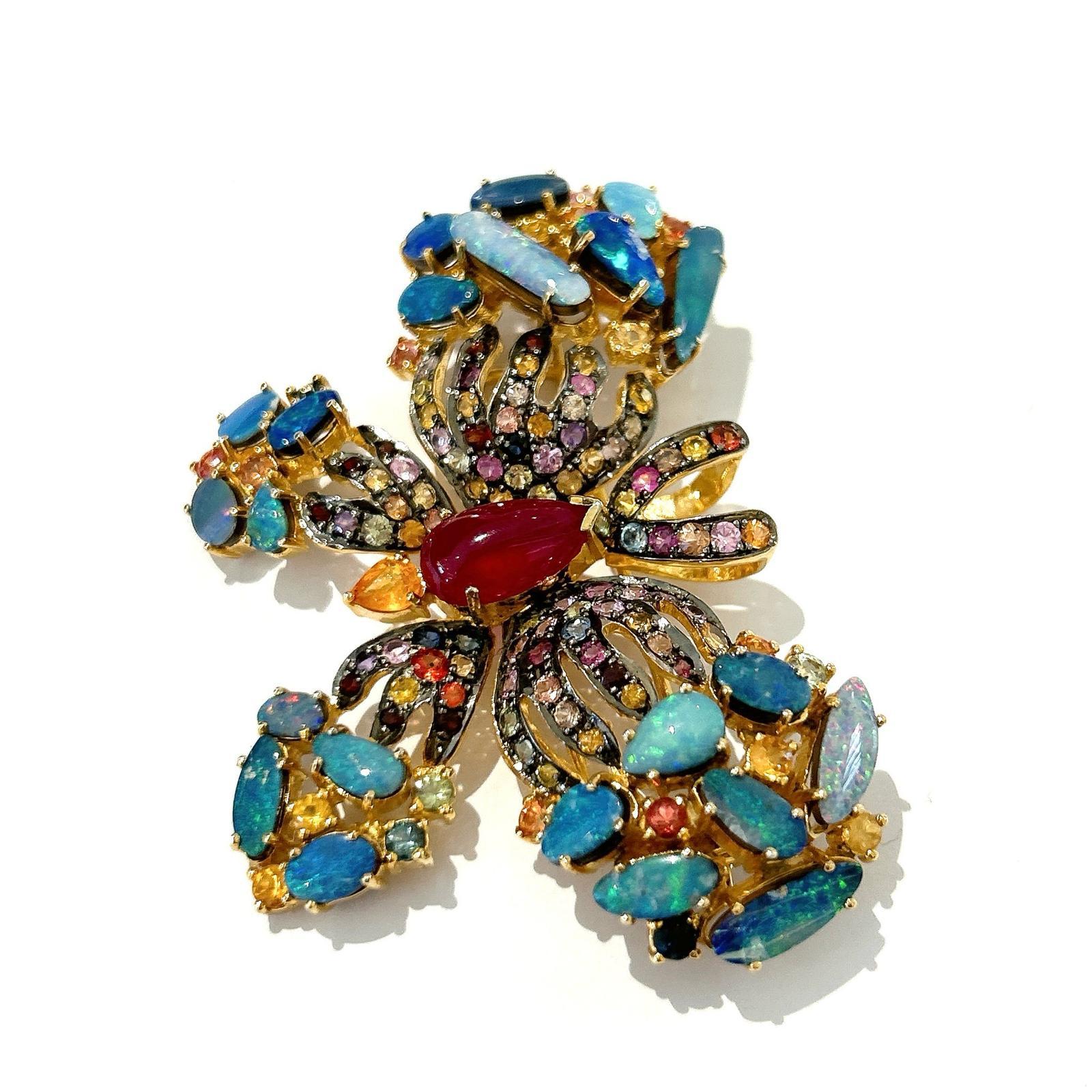 Bochic “Orient” Opal, Multi Sapphires & Ruby Brooch Set In 18K Gold & Silver 

Can be worn as a brooch and a pendant 

Natural Red Ruby  - 4 carat 
Multi color Natural Sapphires from Sri Lanka 
6 carat
Natural Opals  - 22 carat


The Brooch is from