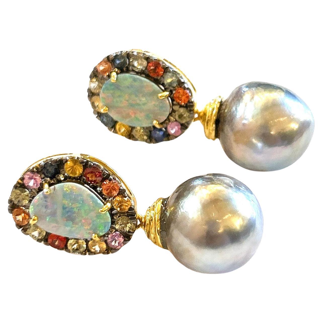 Bochic “Orient” Opal, South Sea Pearls & Sapphires Earrings Set 18K Gold&Silver 

Natural Blue Opal- 4.00 carat 
Multi color sapphires - 2.50 carat 
South sea Tahiti silver pearls 

The earrings from the 