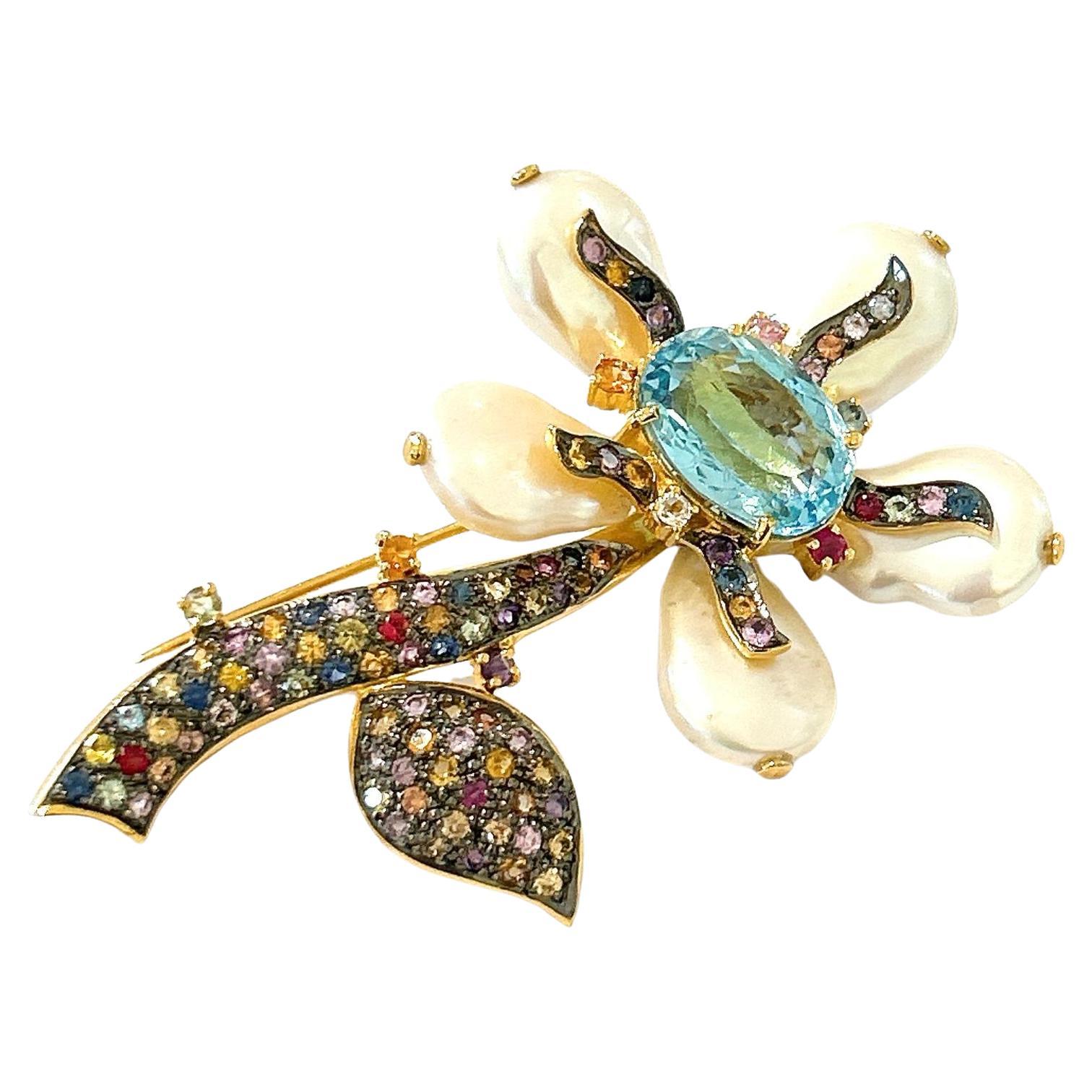 Bochic “Orient” Pearl, Multi Sapphires & Topaz Brooch Set In 18K Gold & Silver 
Can be worn as a brooch and a pendant 

Natural Blue Topaz   - 4 carat 
Multi color Natural Sapphires from Sri Lanka 3 carat
Natural South Sea Pearls 


The Brooch is