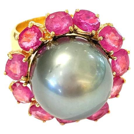 Bochic “Orient” Red Ruby & Black Tahiti Pearl Ring Set In 18K Gold & Silver 

Natural Oval Shape Red Rubies - 8 Carats 
Black Natural Tahiti Pearl Gray Color with Pink tone 

This Ring is from the 