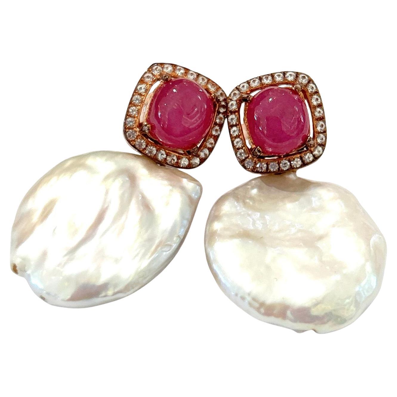 Bochic “Orient” Red Ruby & South Sea Pearls Earrings Set In 18K Gold&Silver 

Natural Red Ruby - 3.00 carat 
Natural White Topaz  - 0.50 carat 
South sea white pearls 

The earrings from the 