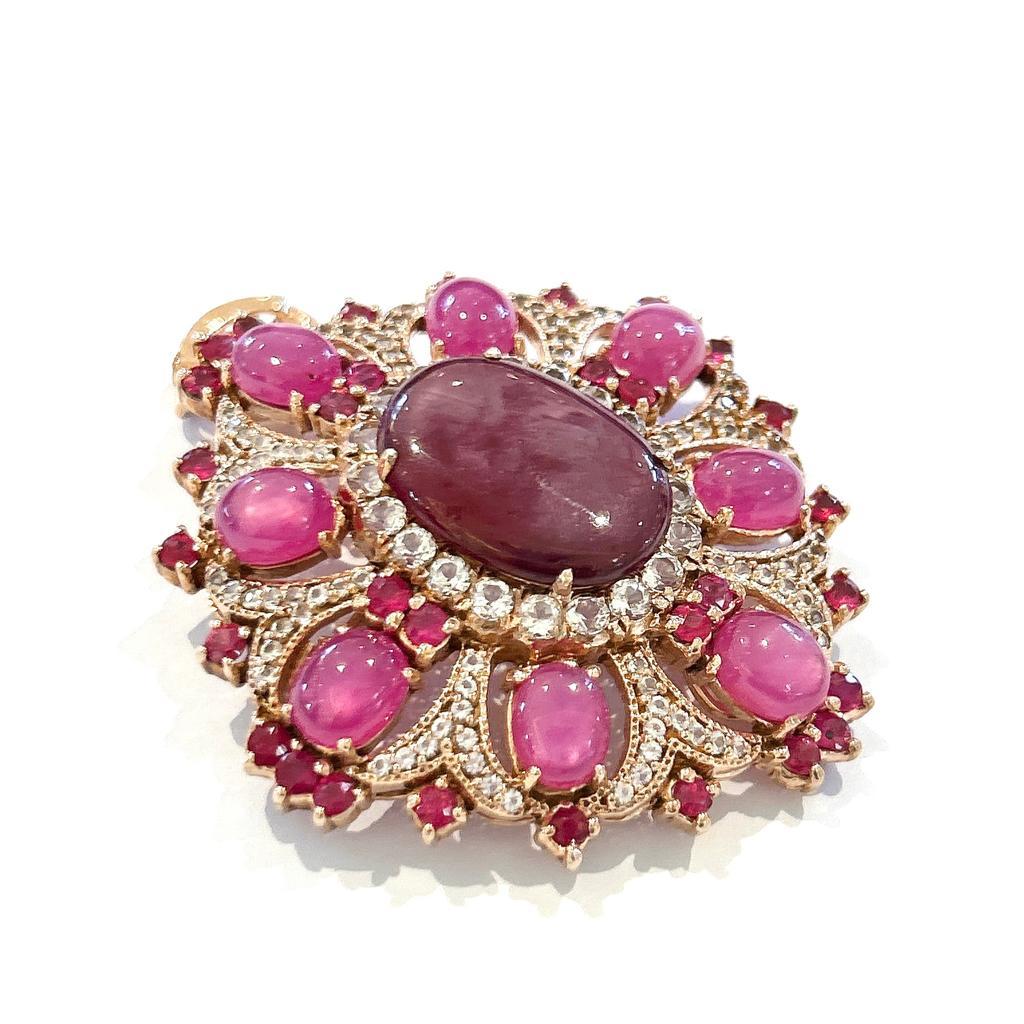 Bochic “Orient” Red Ruby & White Topaz Brooch Set In 18K Gold & Silver 

Natural Red Ruby, Oval shapes - 16 Carats 
Natural Sapphires from Sri Lanka -1 carat 
White Topaz  - 2 carat 

Brooch can also be worn as a Pendent 

The Brooch is from the