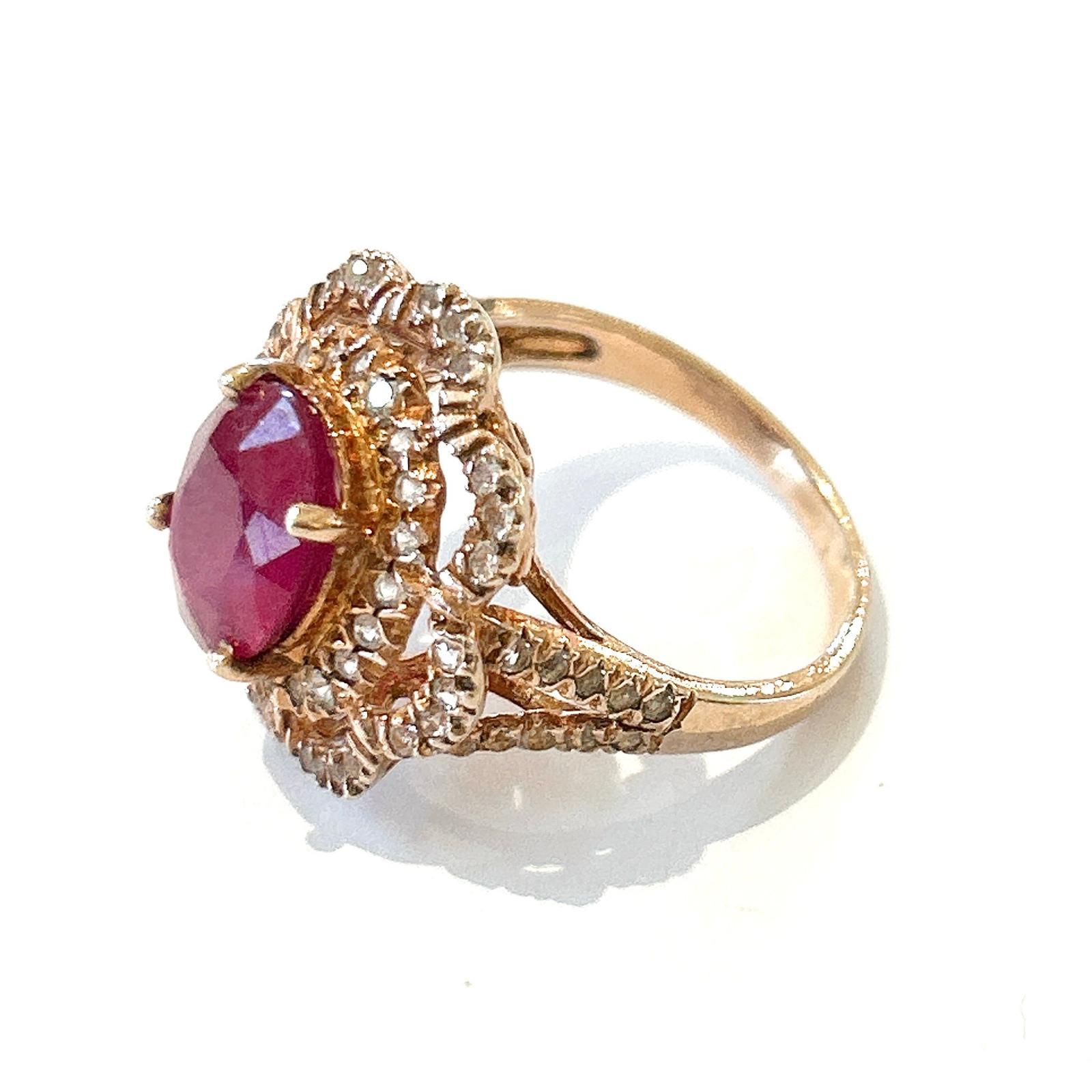Bochic “Orient” Red Ruby & White Topaz Cocktail Ring Set In 18K Gold & Silver 

Natural Red Ruby Oval Shape - 5 carats 
Natural White Topaz -  2 carats

This Ring is from the 