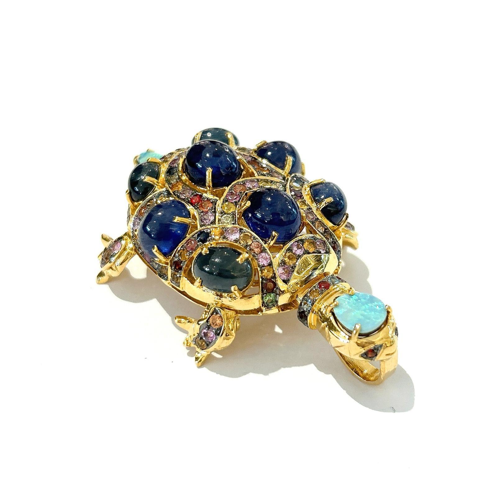 Bochic “Orient” Retro Multi Sapphires & Opal Brooch Set In 18K Gold & Silver 

Can be worn as a brooch and a pendant 

Blue color Natural Sapphires from Sri Lanka 
27 carat
Multi color Natural Sapphires from Sri Lanka 
5 carat 
Blue Opals 
0.50