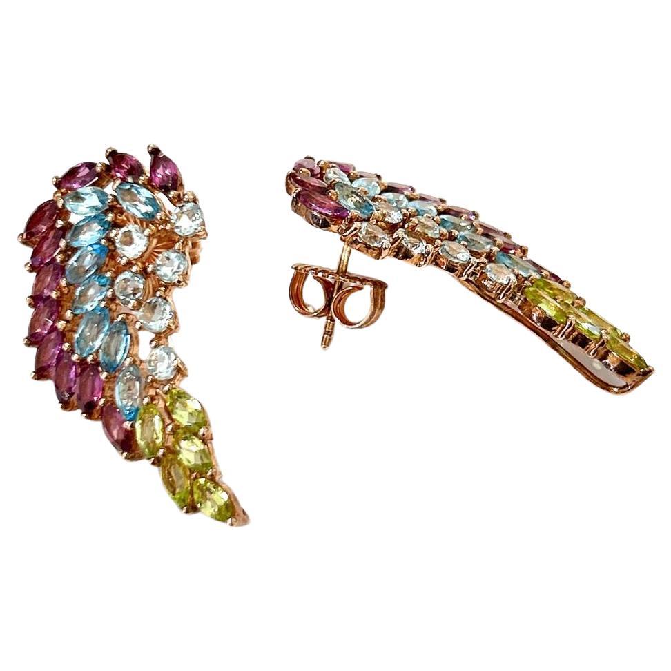 Bochic Orient Ohrringe aus 18 Karat Gold und Silber mit Rodorit, Topas und Peridot 

Die Ohrringe der Kollektion 