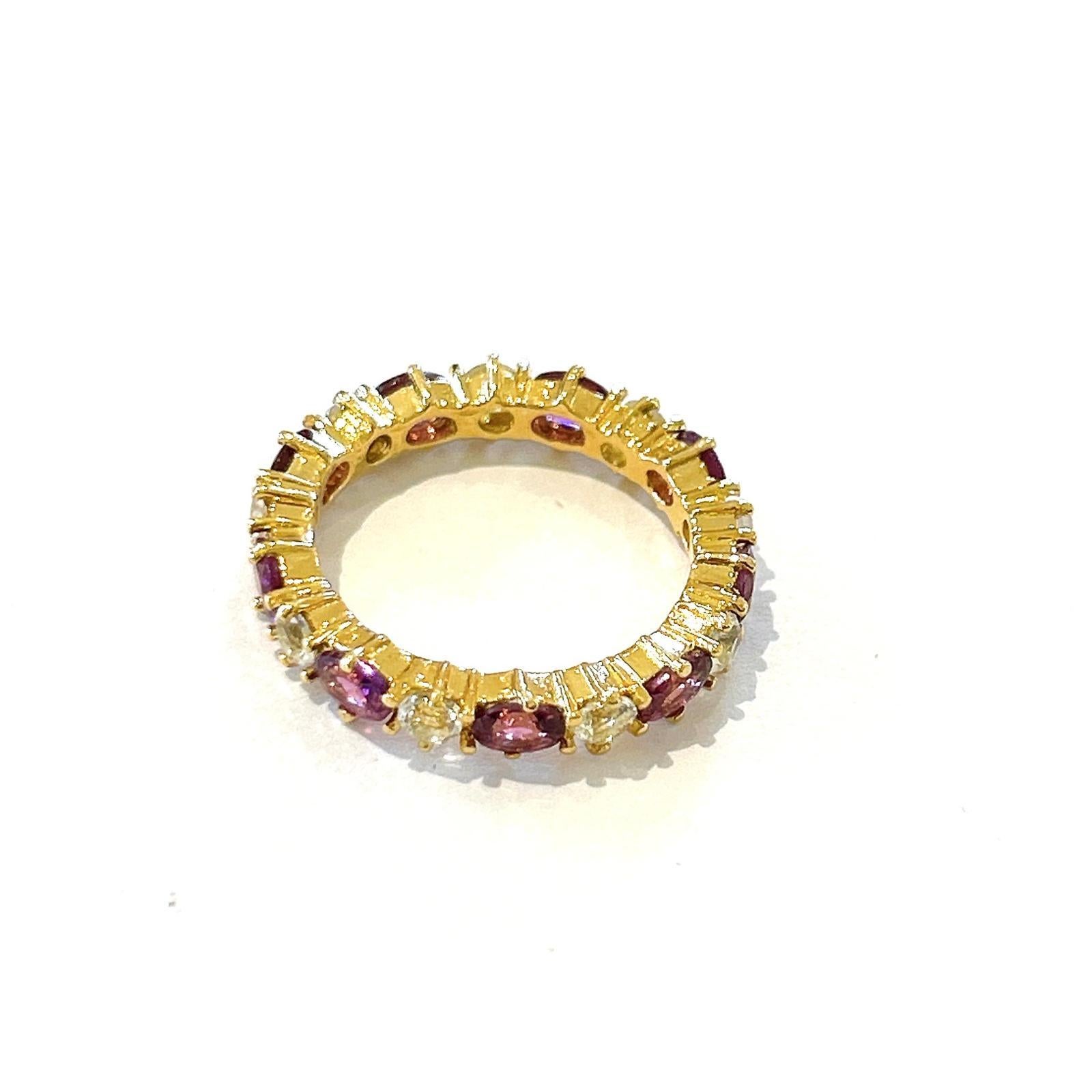 Bochic “Orient” Rose Rodorite & White Topaz Eternity Band Ring 18K Gold & Silver 

Tanzanite and White Topaz - 3 Carat 

This Ring is from the 
