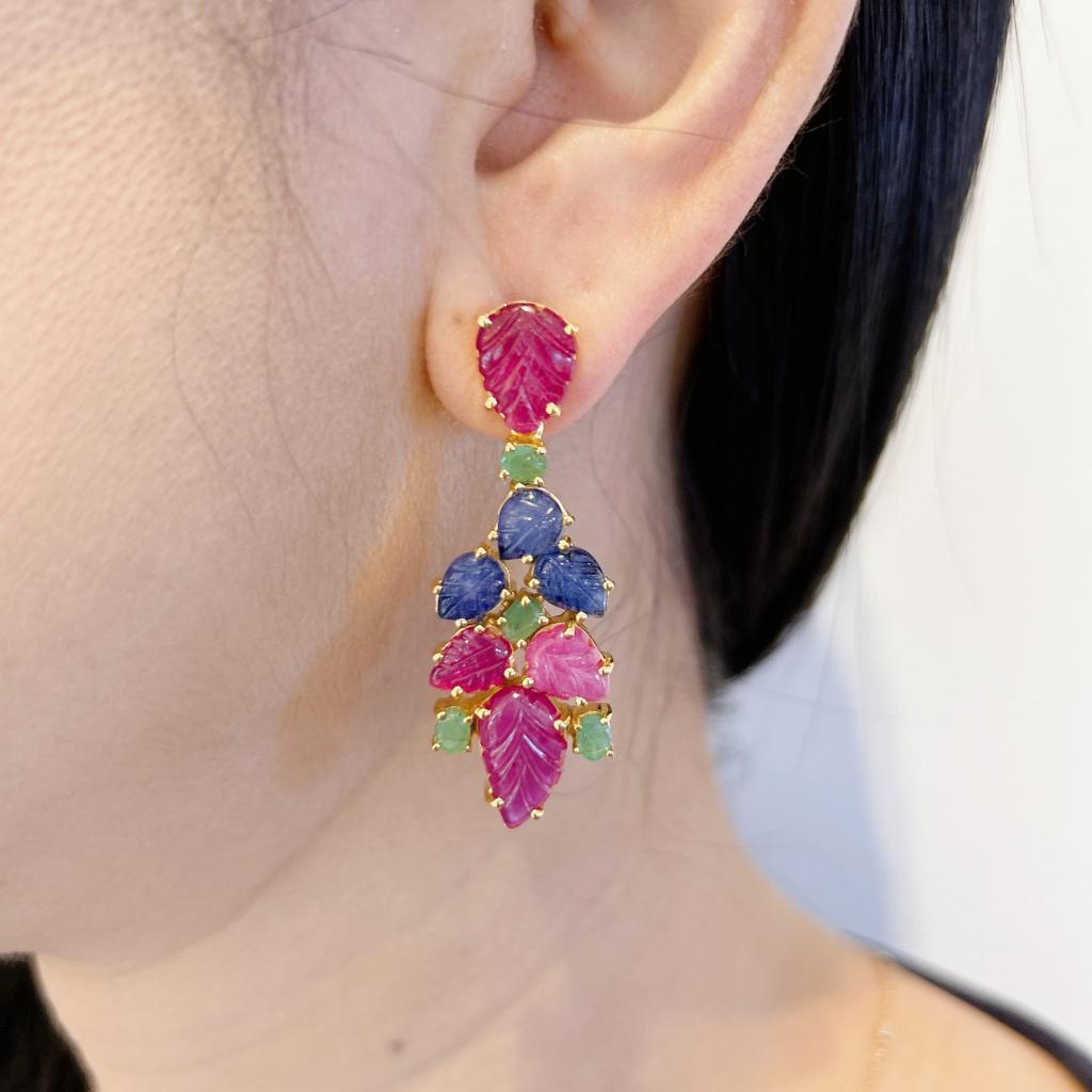 Bochic “Orient” Ruby, Emerald & Sapphire Earrings Set In 18K Gold & Silver 
Ruby - 12 Carat 
Emerald from Zambia - 6 Carat 
Blue Sapphire from Sri Lanka - 6 Carat 
The earrings from the 