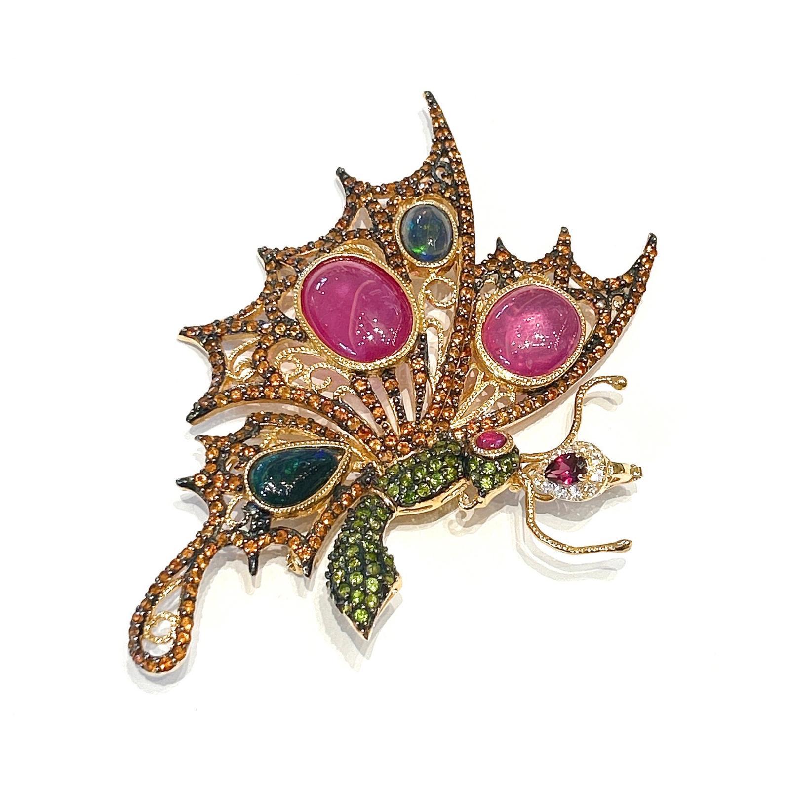 Bochic “Orient” Ruby, Multi Sapphires & Tsavorite Brooch Set 18K Gold & Silver 

Can be worn as a brooch and a pendant 

Natural Red Ruby  - 24 carat 
Multi color Natural Sapphires from Sri Lanka 
6 carat
Green Tsavorite - 3 carat 
Orange