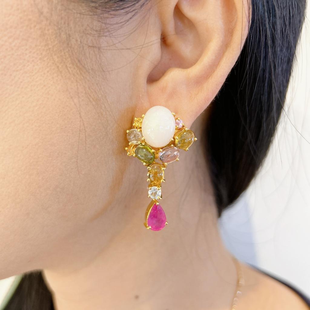 Bochic “Orient” Ruby, Opal &b Multi Gem Earrings Set In 18K Gold & Silver 
Natural Red Ruby Pear shape drops - 4 carats 
Natural White Opals, cabochon shapes - 6 carats 
Multi color Tourmaline gems -8 carats

The earrings from the 