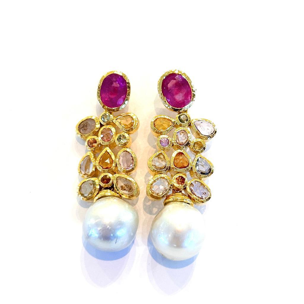 Bochic “Orient’ Ruby & Rose Cut Sapphires, Pearls Earrings Set In 18 K Gold & Silver 
Res Ruby’s Natural and Oval shapes 
Rose Cut Natural Multi pastel Color Sapphires from Sri Lanka 
South Sea Golden Pearls 

The earrings from the 