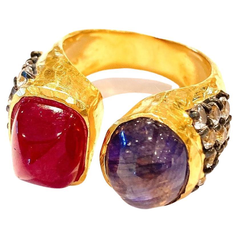 Bochic “Orient” Ring  set 22K Gold & Silver with Ruby & Sapphires 
Natural Blue Color Cabochon Sapphire from Sri Lankan  - 6 carats 
Natural Red Color Cabochon Ruby - 7 carats 
Natural White round brilliant Topaz  - 3 carats 
Set in 22K Gold and