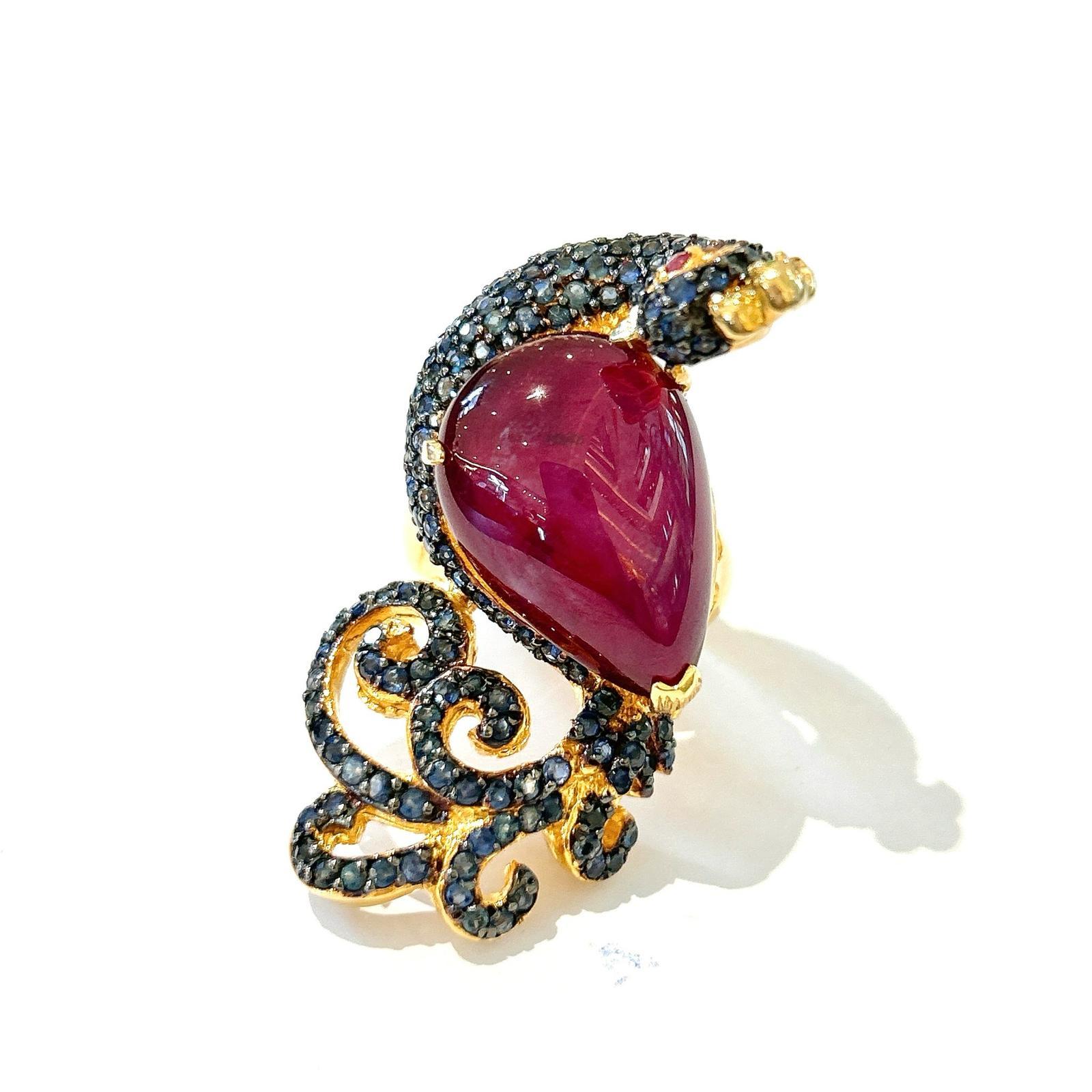 One of a kind Bochic “Orient” Ruby, Emerald & Sapphire Swan Cocktail Ring Set 18K & Silver 

Natural Red Pear shape Ruby - 7 carats 
Natural Blue sapphires  - 2 carats 

This Ring is from the 