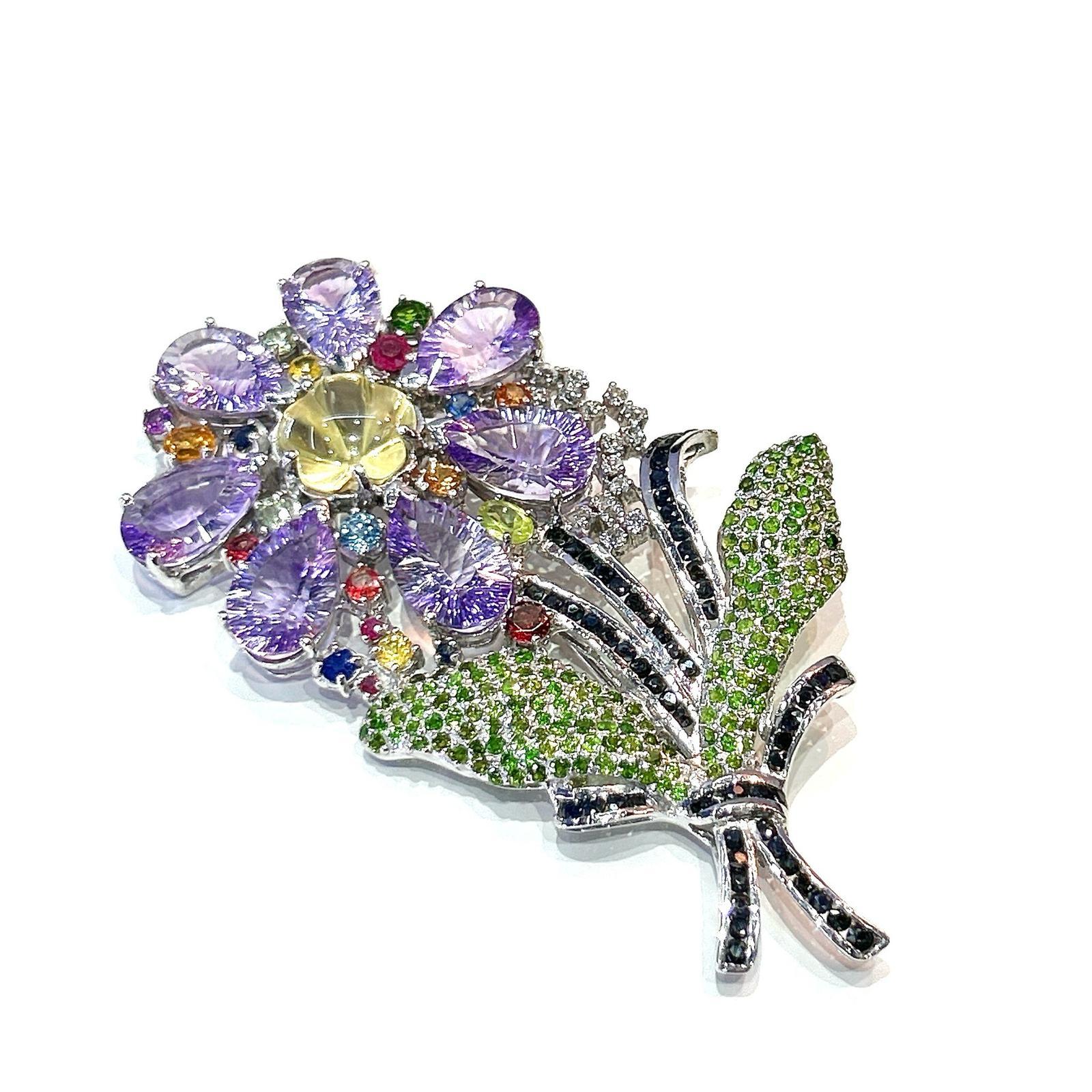 Bochic  “Orient” Sapphire, Amethyst & Tsavorite Brooch Set In 18K Gold & Silver

Natural Amethyst - 12 carat
Natural Tsavorite  - 4 carat 
Natural Sapphires from Sri Lanka - 3 carat
Natural Ruby - 1 carat

Can be worn as a pendent as well. 

The
