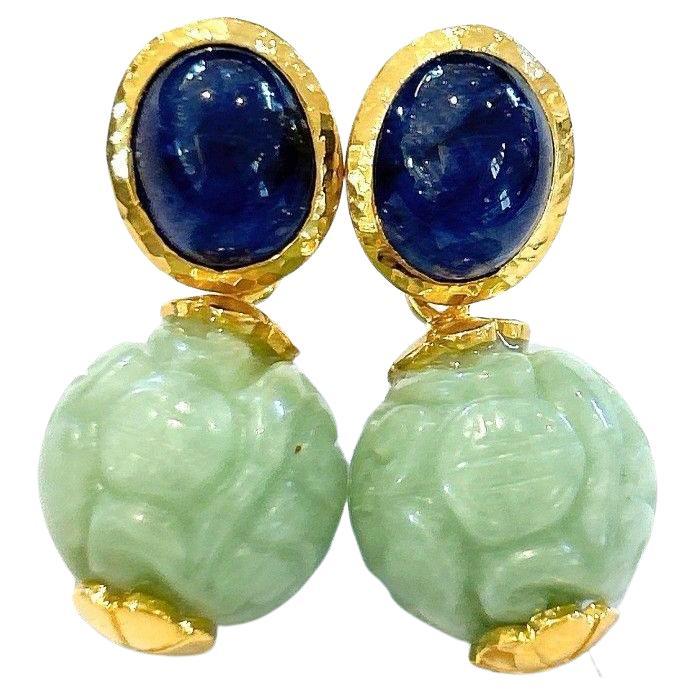 Bochic “Orient” Sapphire & Carved Vintage Mint Jade Earrings 18K Gold & Silver

Natural Fancy Blue Sapphires, Oval Shape 
12 Carat 
Carved Vintage Mint Jade 

The earrings from the 