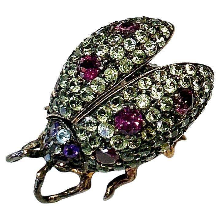 Broche Escarabajo Bochic "Orient" Zafiro< Granate y Rubí engastado en oro de 18 quilates y plata