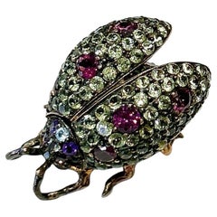 Broche Escarabajo Bochic "Orient" Zafiro< Granate y Rubí engastado en oro de 18 quilates y plata