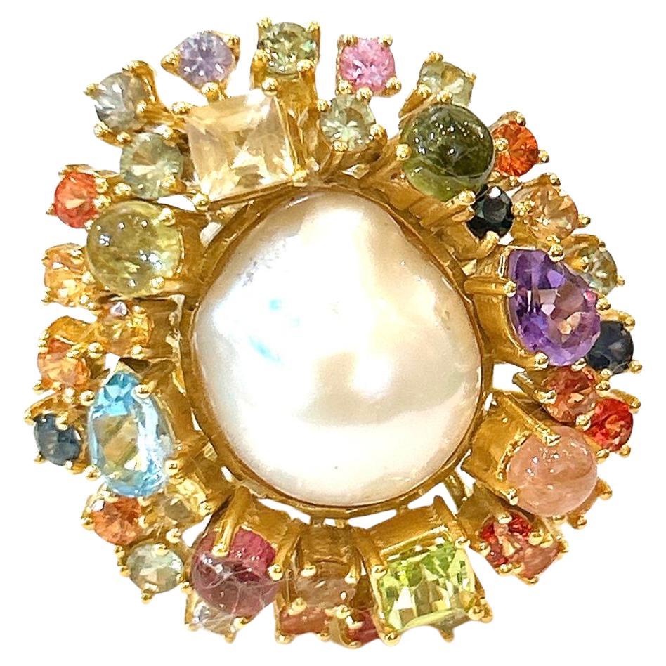 Bochic “Orient” Sapphire & Multi Fancy Gem Cocktail Ring Set 18K Gold & Silver 

Natural Sapphires  - 2 Carat 
Natural Multi Color Tourmalines - 3 Carat
Natural Blue Topaz  - 1.50 Carat 
Natural Amethyst - 1 Carat
Natural peridot - 1.50 Carat 
Pearl