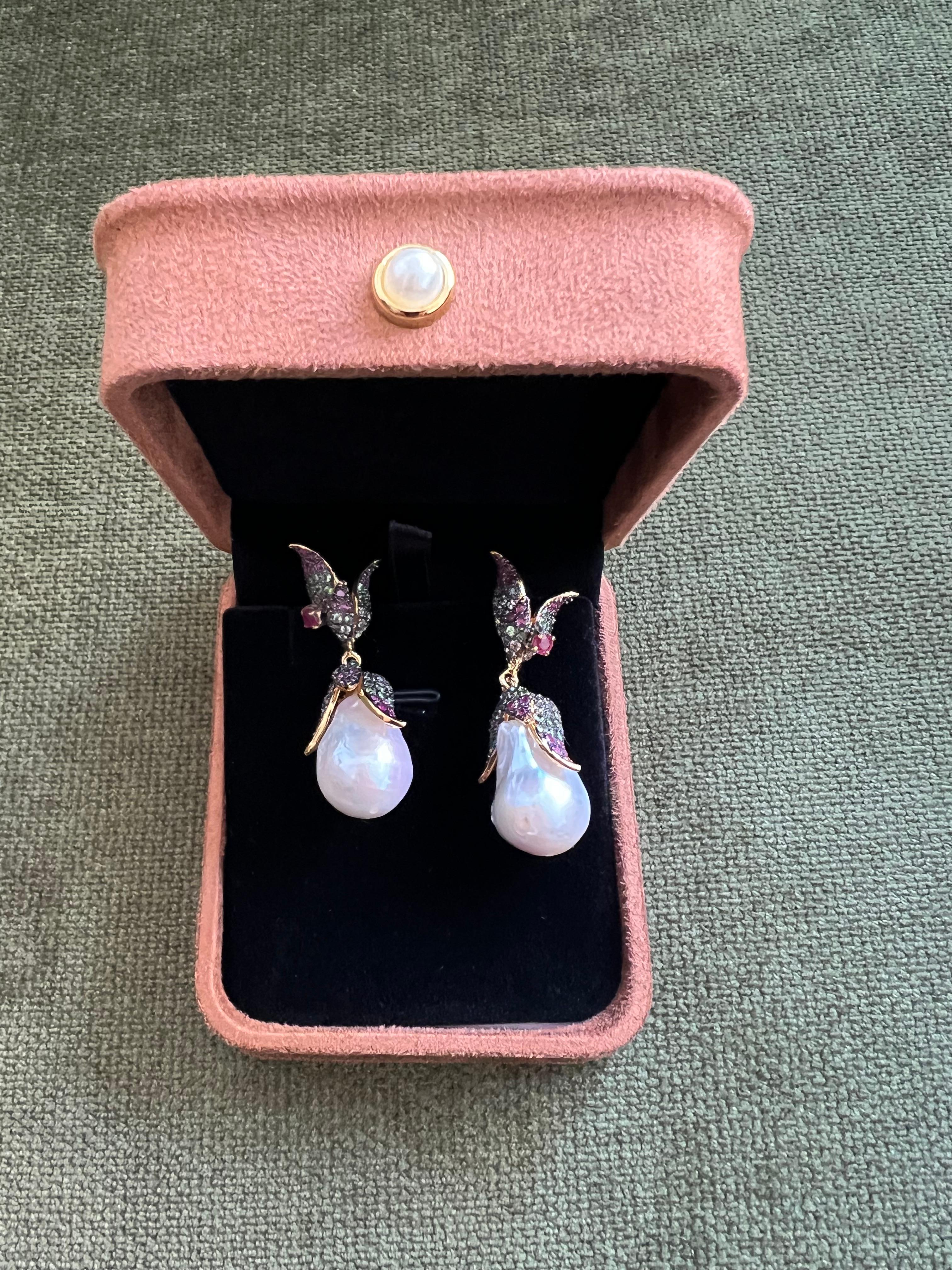 Bochic “Orient” South Sea Pearl, Sapphire & Ruby Earrings Set 18K Gold & Silver

Natural Multi Color Sapphires  - 2.00 carats 
Natural Ruby -1.00 carats 
White Barque South Sea Pearls 

The earrings from the 