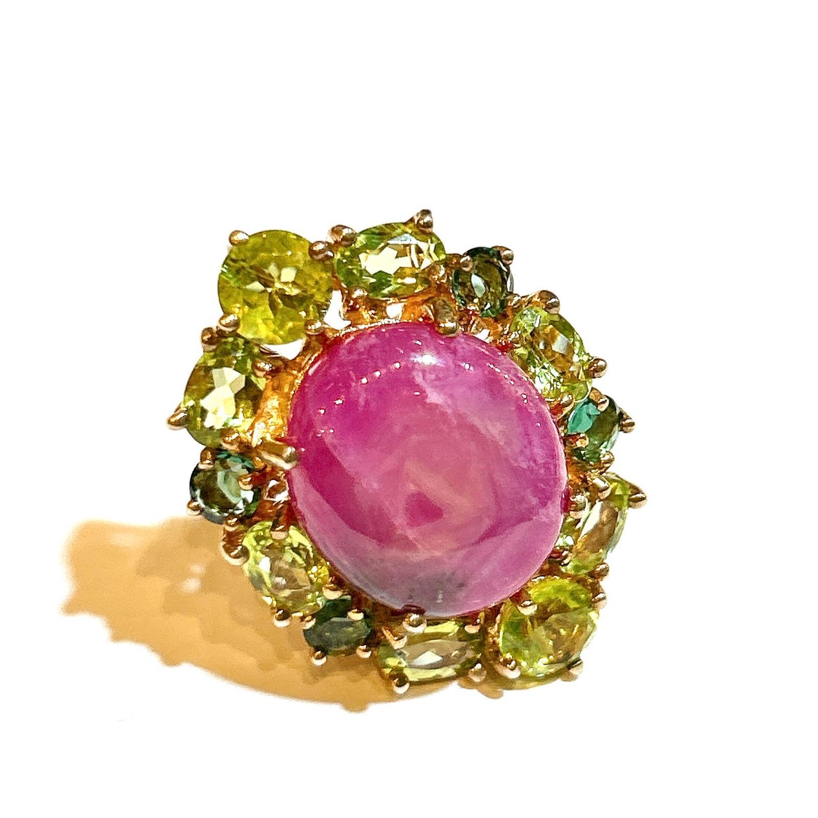 Bochic “Orient” Star Ruby & Green Perridot Cocktail Ring 18K Gold & Silver 

Natural Oval Red Ruby Cabochon   - 9 Carat 
Natural Green Perridot  - 4 Carat
Natural Chrome dioxide - 7 Carat 

This Ring is from the 