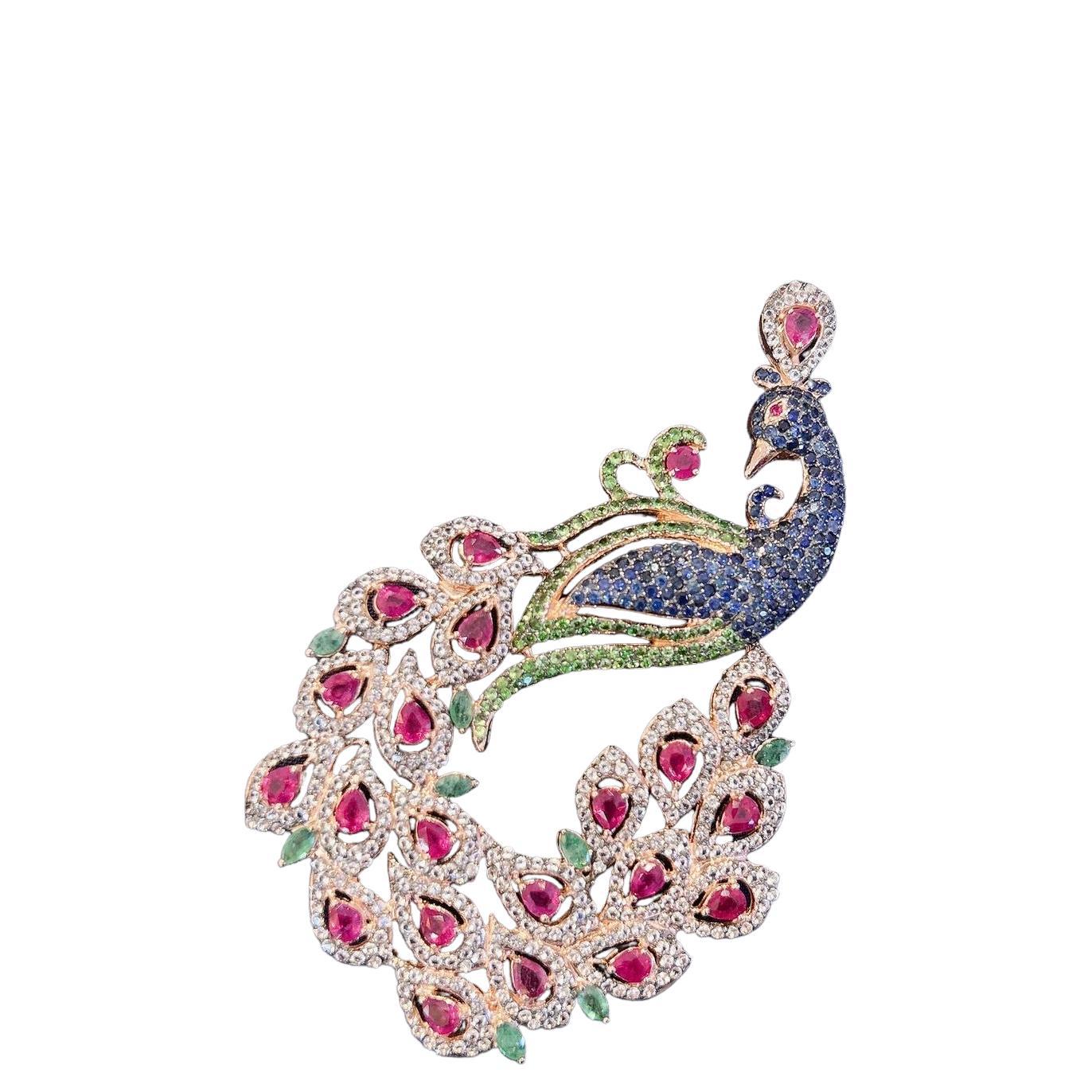 Bochic “Orient Swan” Blue Sapphire, Emerald, Ruby Brooch In 22K Gold & Silver 
From the “Orient” collection 
Natural Blue Sapphire - 3 carats 
From Sri Lanka
Natural Red Rubies  - 16 carats 
Pear shapes 
Natural Green Emeralds from Zambia 
White