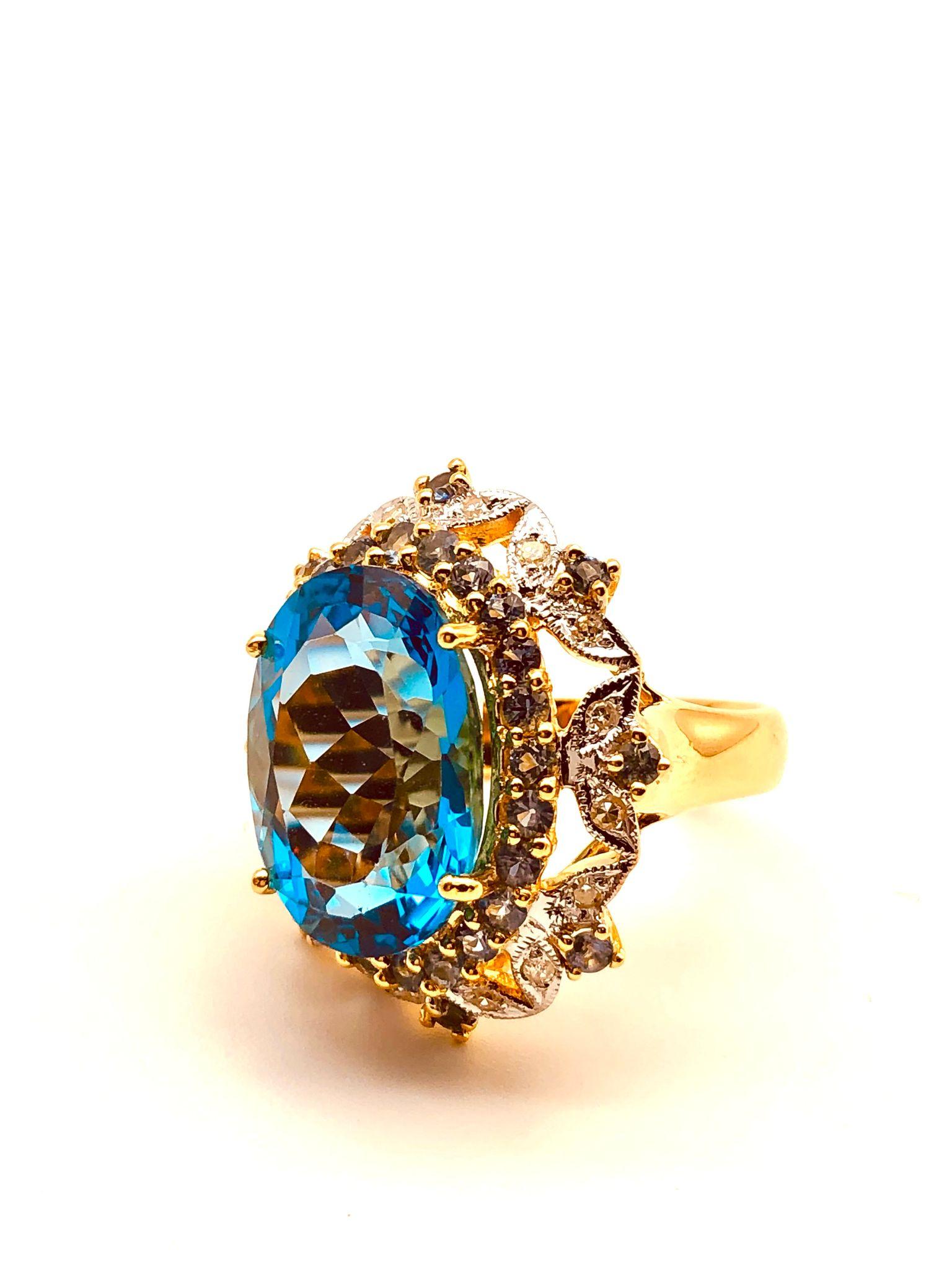 Bochic “Orient” Natural Swiss Blue Topaz, Natural Blue Sapphire & Natural Diamonds Cocktail Ring Set In 18K Gold & Silver 

Natural Oval Shape Swiss Blue Topaz - 9.50 Carat 
Natural Round Brilliant Cut Fancy Yellow Diamonds 
2.00 Carat
Natural Round