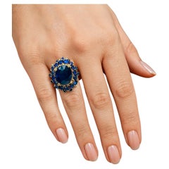 Anello Vintage "Orient" con zaffiro blu e diamanti a grappolo 18K e Siver