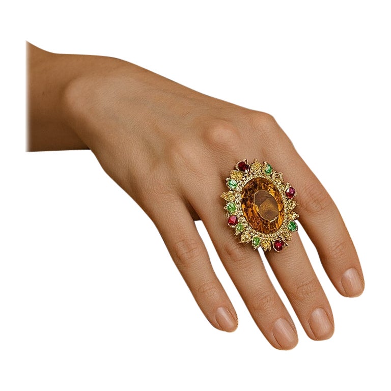 Bochic “Orient” Natural Vintage Cognac Citrine, Peridot & Rhodolite Ring Set In 18K Gold & Silver 

Natural Center Citrine
24.00 Carat 
Natural Peridot, Rhodolite, Citrine
5.00 Carats 
Natural Diamond 
1.00 Carat 

This Ring is from the 