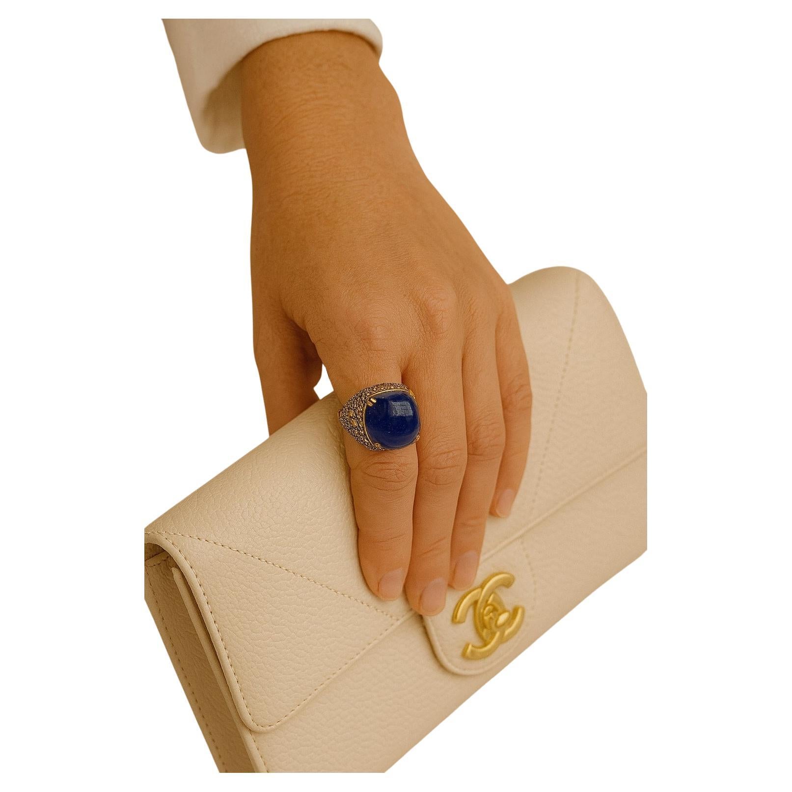Bochic “Orient” Vintage Natural Diamond, Sapphire & Multi Gem Ring Set In 18K Yellow Gold & Silver 

Natural Cabochon Blue Sapphire - 16 carat
Natural multi color Sapphires and Rubies - 3 carat 
Natural Diamonds - 1 carat 

This Ring is from the