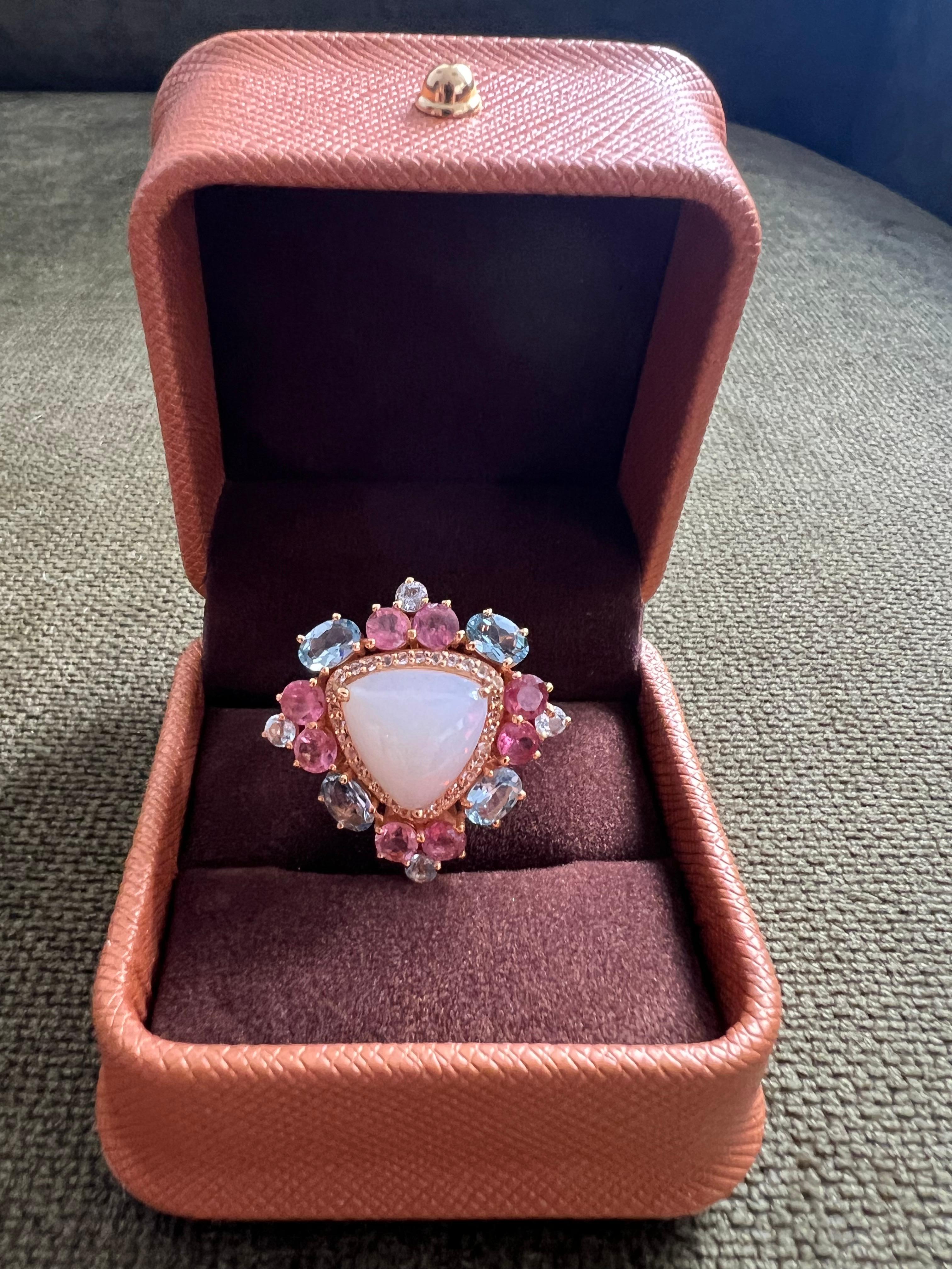 Bochic “Orient” Vintage Diamond, Tanzanite, Fire Opal & Pink Sapphire Ring Set 18K Gold & Silver 

Natural Center Fire Opal 
12.00 Carat 
Natural Tanzanite
Natural Single Cut Diamonds 
Natural Pink Sapphires 
5.00 Carat

This Ring is from the