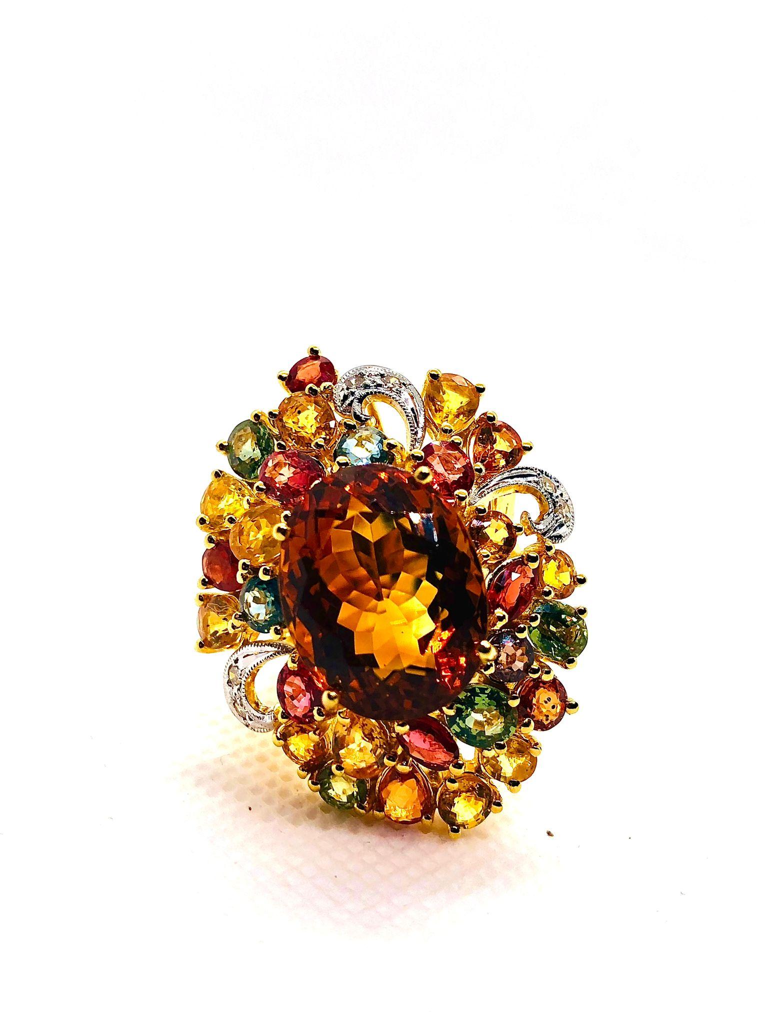 Bochic “Orient” Vintage Natural Citrine, Diamond & Multi Sapphire Ring Set In 18K Gold & Silver 

Natural Center Citrine 
9.00 Carat 
Natural Fancy Multi Color Sapphires
15.00 Carat
Natural Diamonds
1.00 Carats 

This Ring is from the 