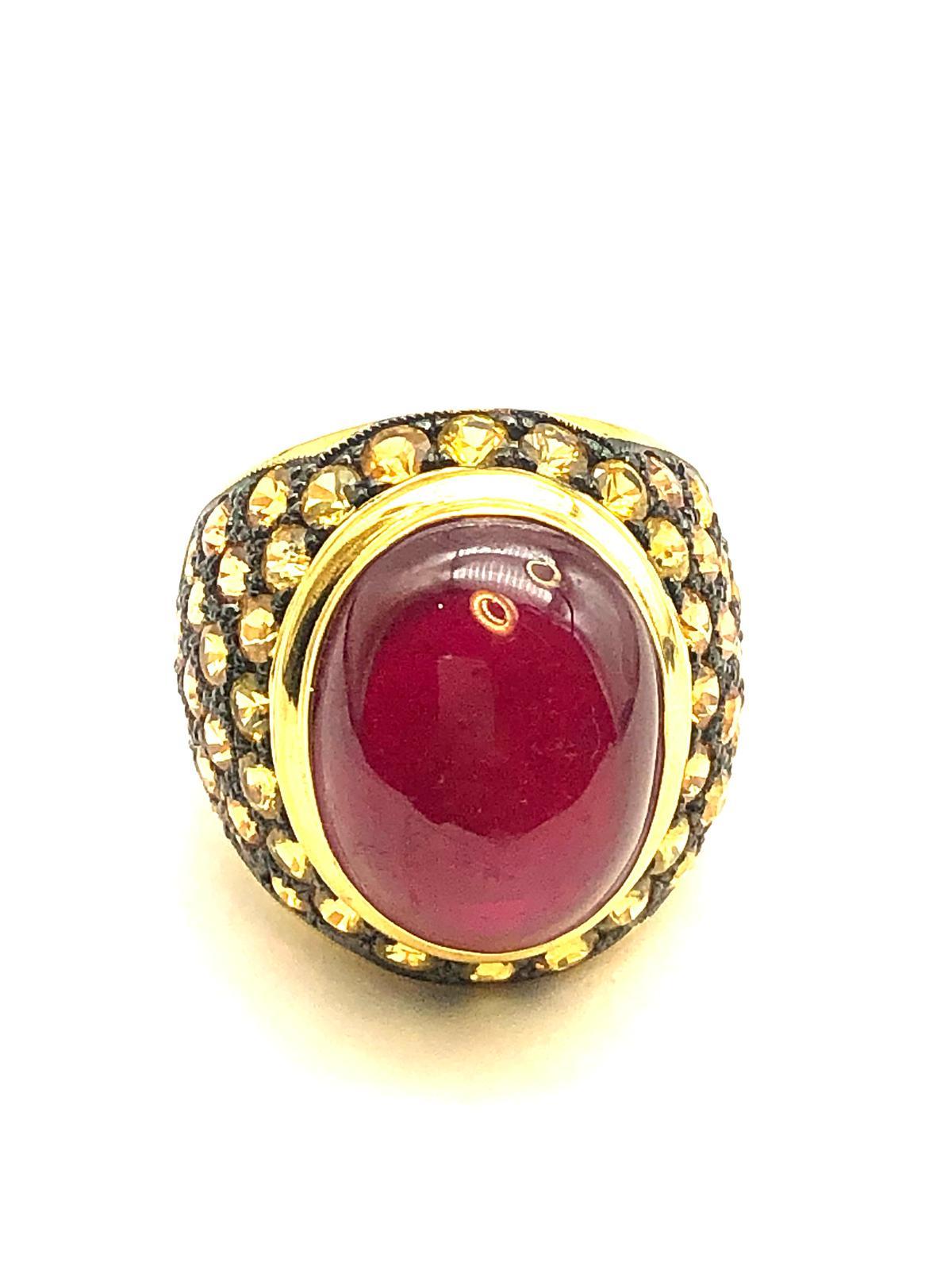 Bochic “Orient” Natural Yellow Sapphire & Ruby Cocktail Ring Set In 18K Gold & Silver 

Natural Cabochon Ruby - 7.50 Carat 
Natural Round Brilliant Yellow Sapphire  - 2.00 Carat 

This Ring is from the 