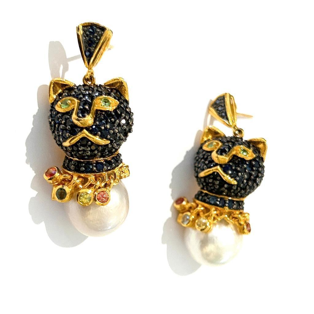 Bochic “Retro” Sapphire & South Sea Pearl Cat Earrings Set In 18K Gold & Silver 

Blue Natural Sapphires from Sri Lanka - 2 Carat 
Multi color Natural Sapphires from Sri Lanka - 2.40 Carat
Pink Sapphire, Blue Sapphire, Red Sapphire, Yellow Sapphire,