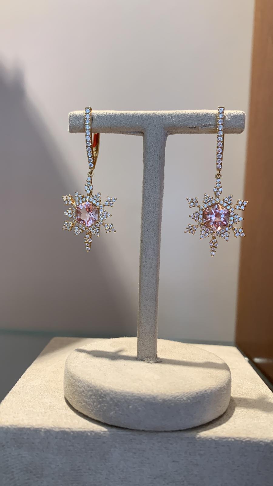 Rose pink tourmaline and Diamond snowflake earrings 
2 tourmaline gems at 2.31 Carat 
Diamond F color and VS clarity 1.01 Carat 
18 K yellow gold 
The earrings are lights and very comfortable to wear day to night. 
Signed 
Comes with a black lather