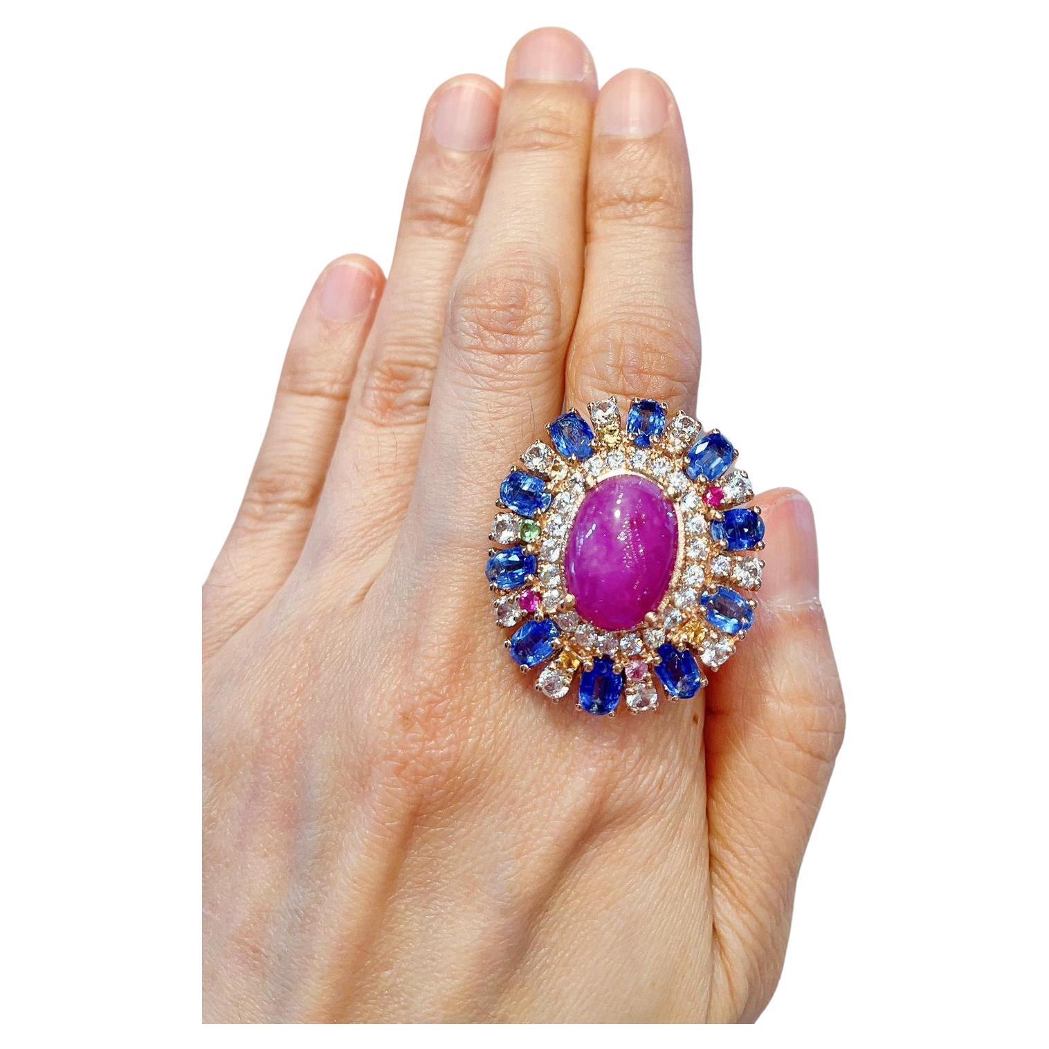 Bochic Ruby, Tanzanite & Fancy Sapphire Candy Cocktail Ring 
Red Natural Ruby Cabochon
11 Carats 
Oval shape tanzanites
Color - deep purple
14 Carats 
Round brilliant fancy Natural Sri Lankan sapphires
Pink sapphire 
Green sapphire 
Yellow sapphire