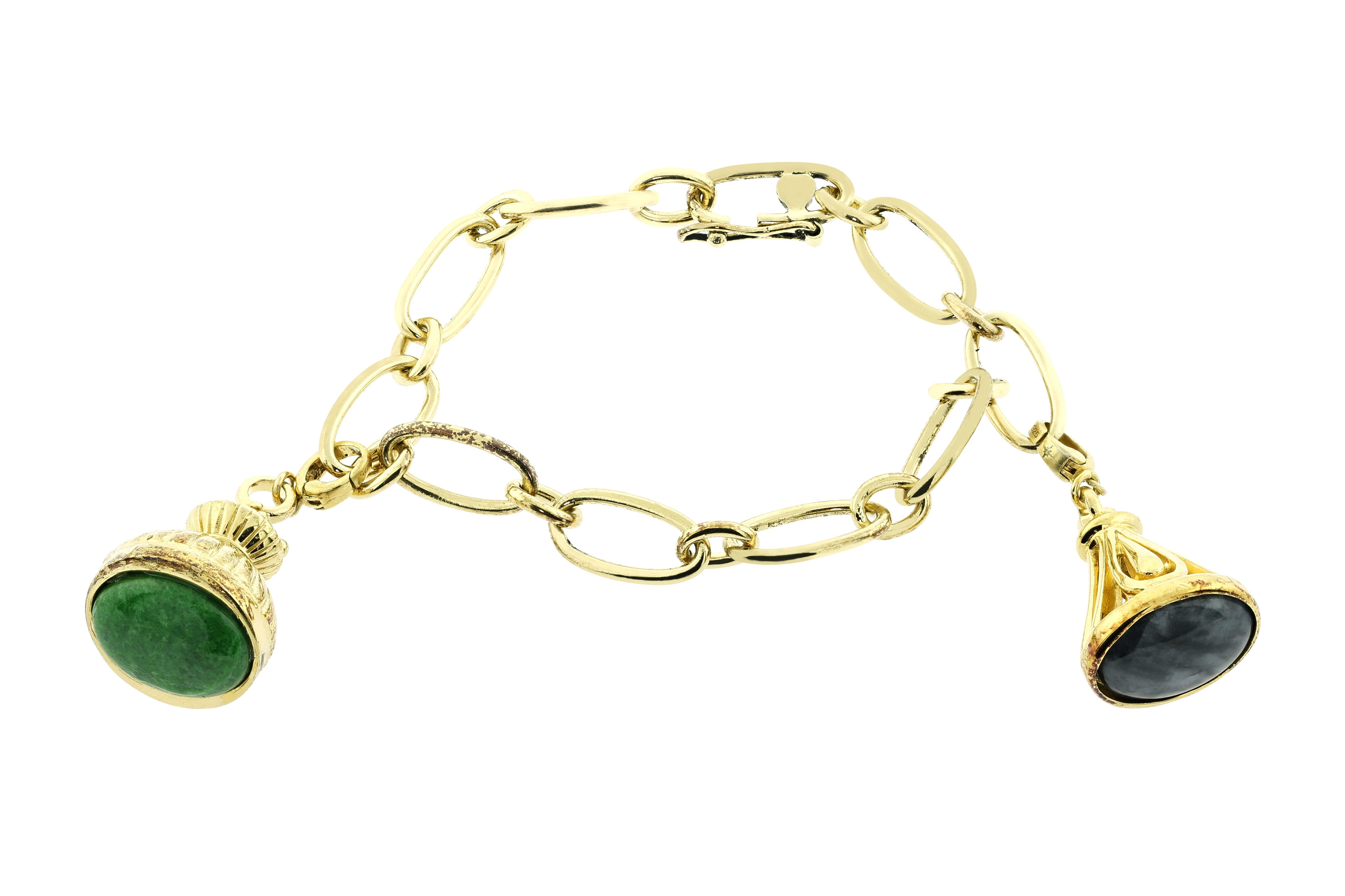 Bochic Vintage jade charm link bracelet. 
Sterling silver and gold plating links and crowns. 
Green vintage jade. 
Black vintage jade. 
Blue Vintage turquoise. 
You can add and detach charms. 
7.5 inch diameter. 
Signed. 
Comes with a Bochic Velvet