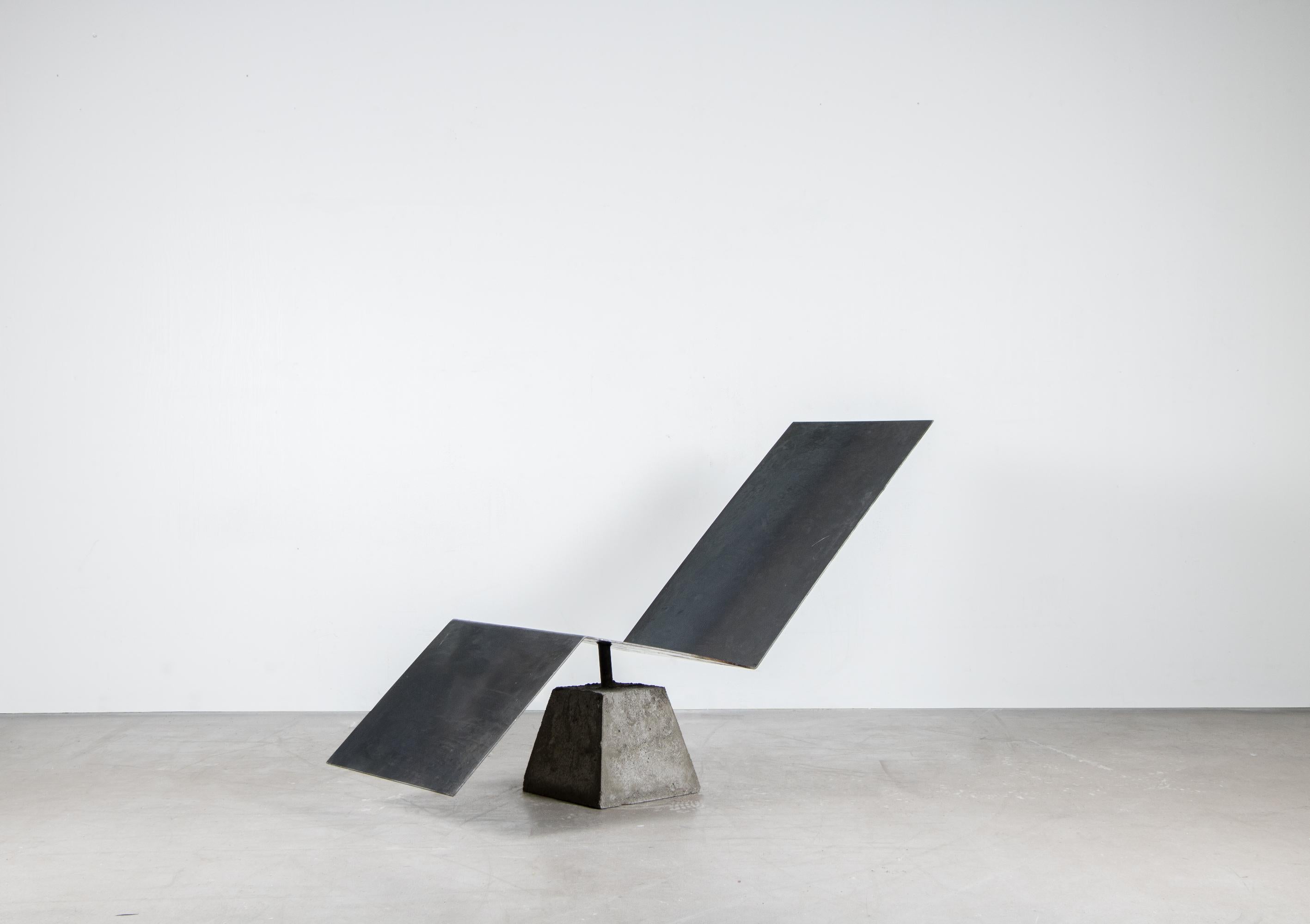 Flykt chair by Lucas Morten
2020
Limited edition of 17
Dimensions: 150 H, 83 W 50 cm
Material: Concrete, burned waxed steel and hand-waxed upholstered cushion

With the vision to build a monument for escapism, flykt chair was sculpted from a