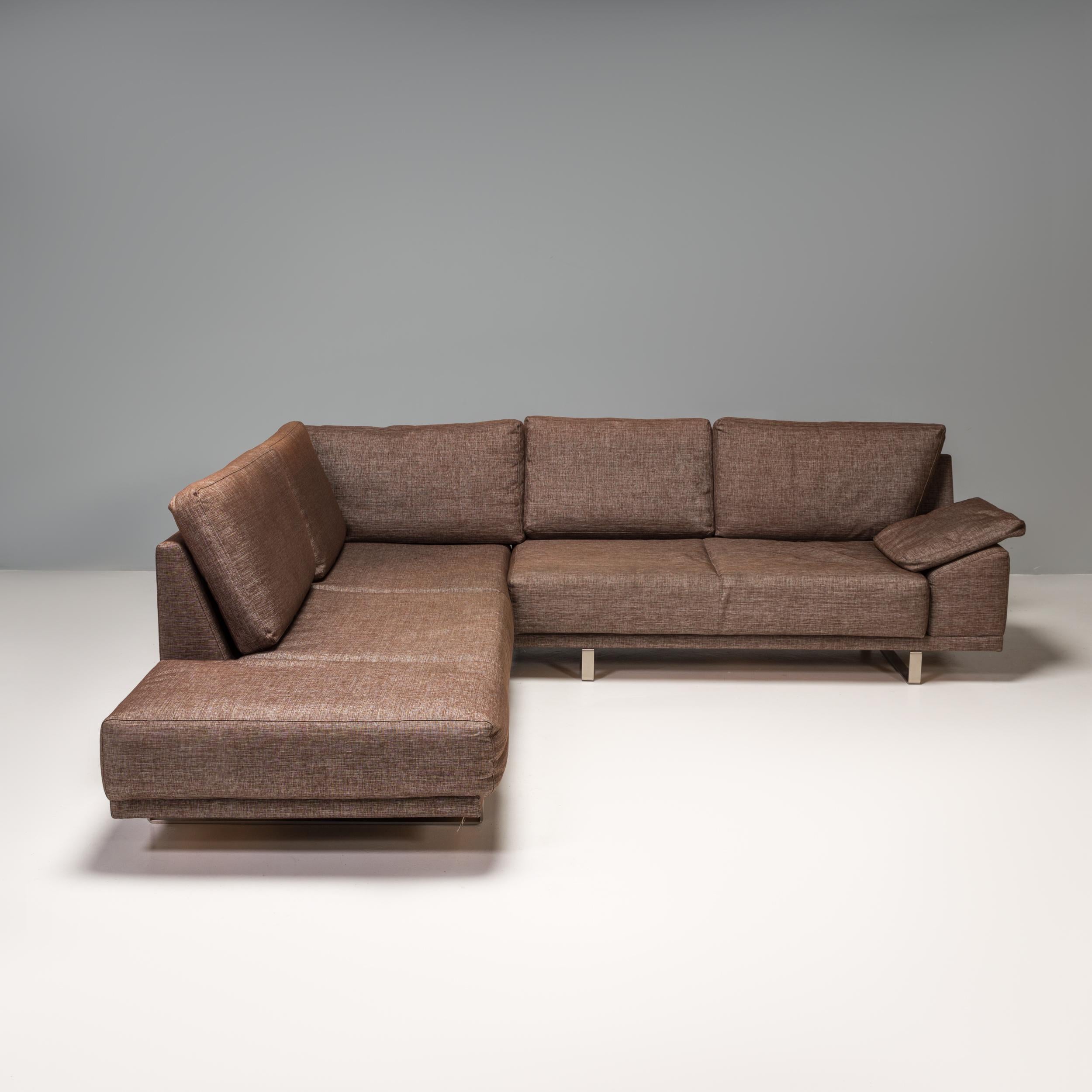 Designed and manufactured by BoConcept, this corner sofa perfectly balances comfort and style.

The deep frame features a wide, angled arm and backrest and sits on curved polished chrome feet.

Fully upholstered in brown fabric, the sofa has
