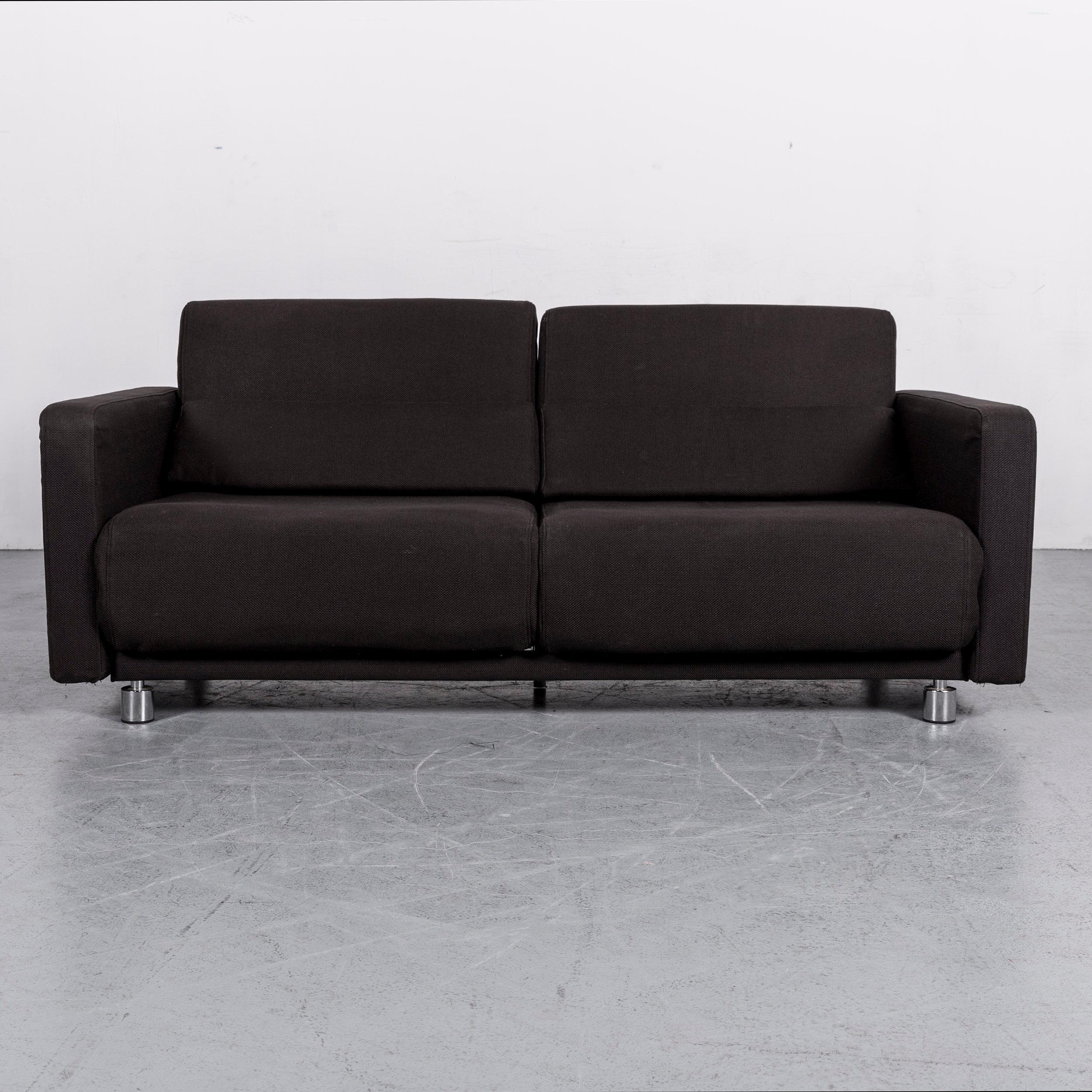 We bring to you an BoConcept Melo designer fabric sofa black two-seat couch with function.