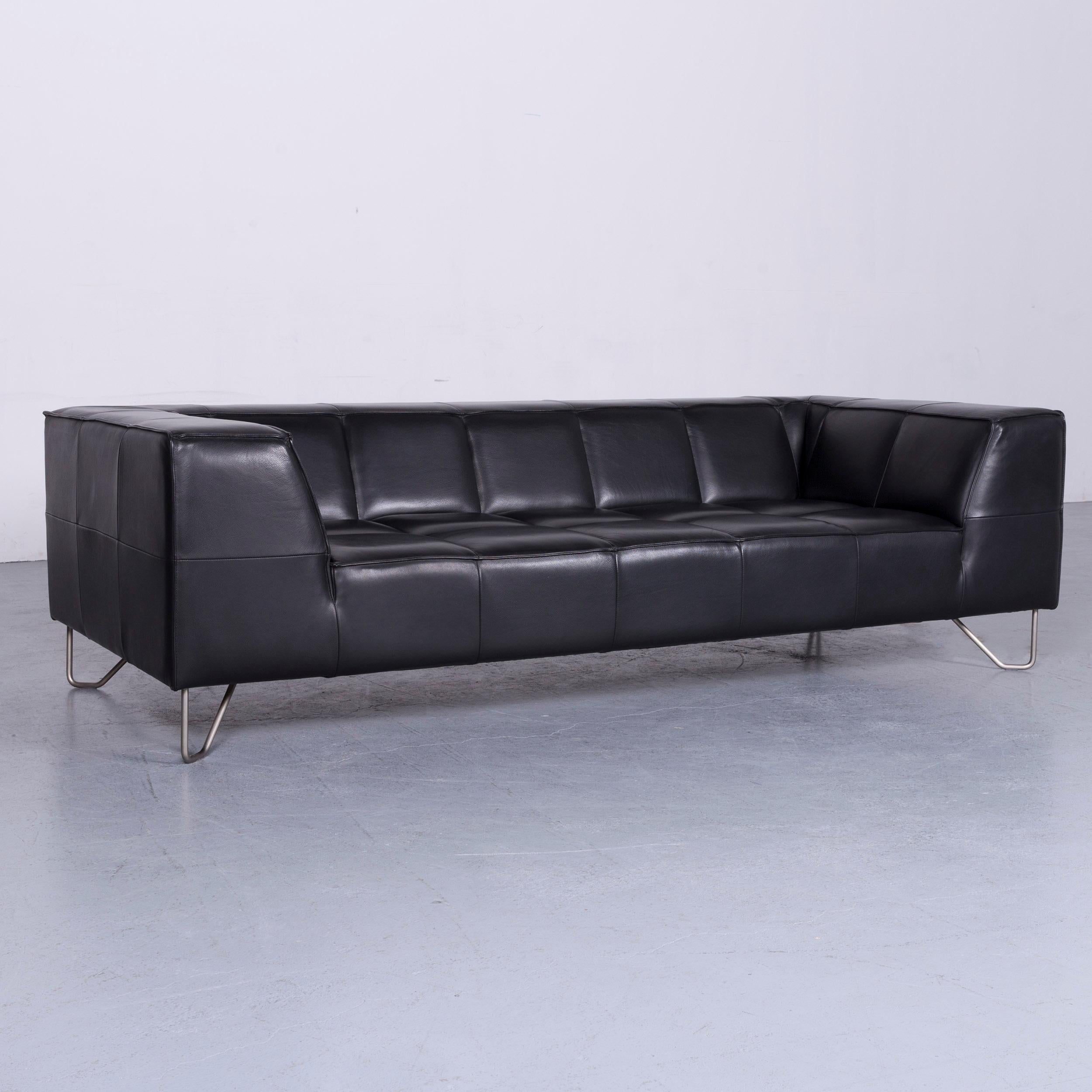 We bring to you a BoConcept Milos designer sofa black leather three-seat couch.