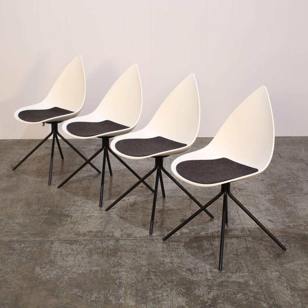 Introducing the BoConcept Ottawa Chair by renowned designer Karim Rashid, now available in a set of four. This sleek and modern chair features a unique curved design, crafted with the highest quality materials for both style and comfort. The smooth