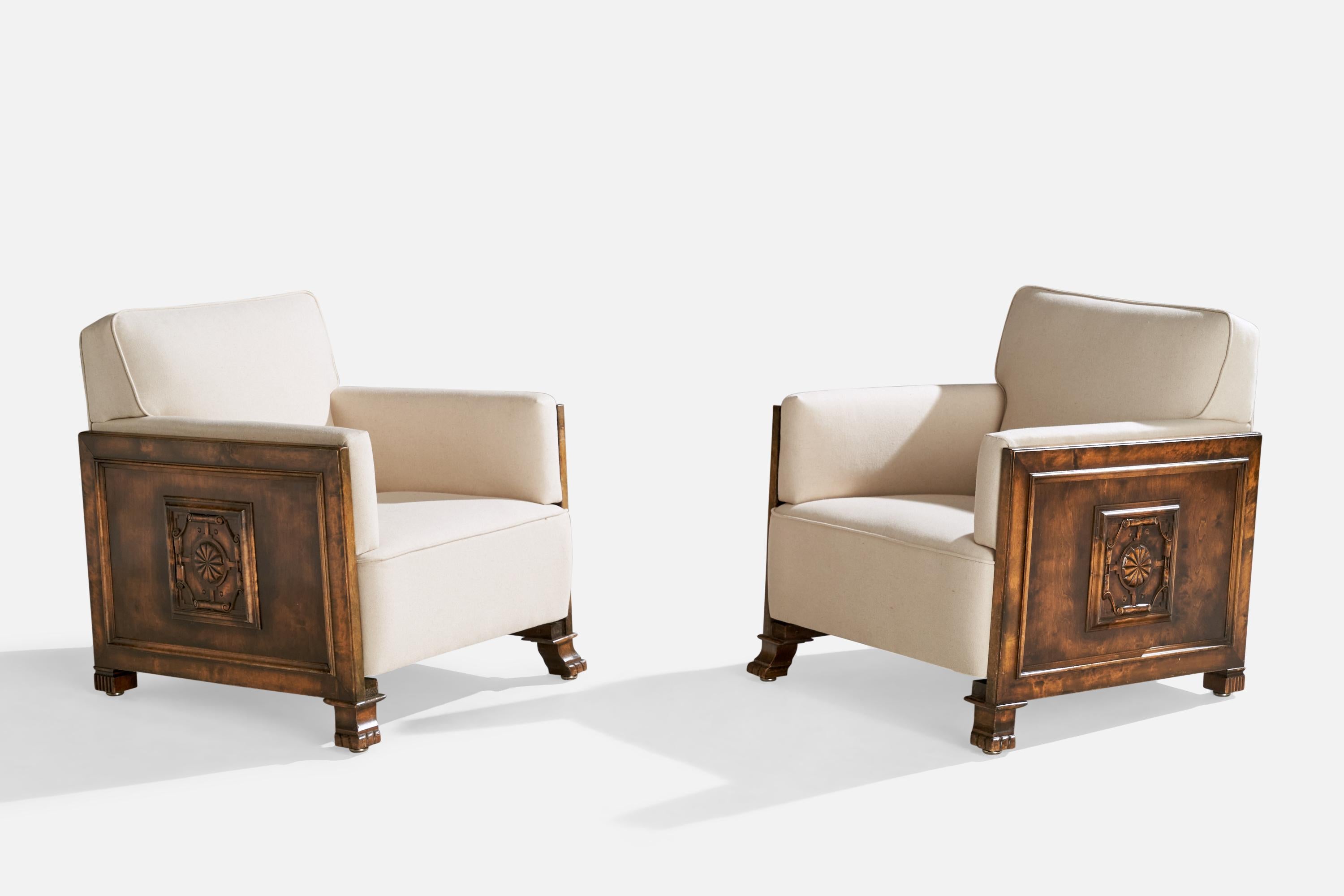 A pair of stained birch and white fabric lounge chairs produced by Bodafors, Sweden, c. 1930s.

Seat height: 16