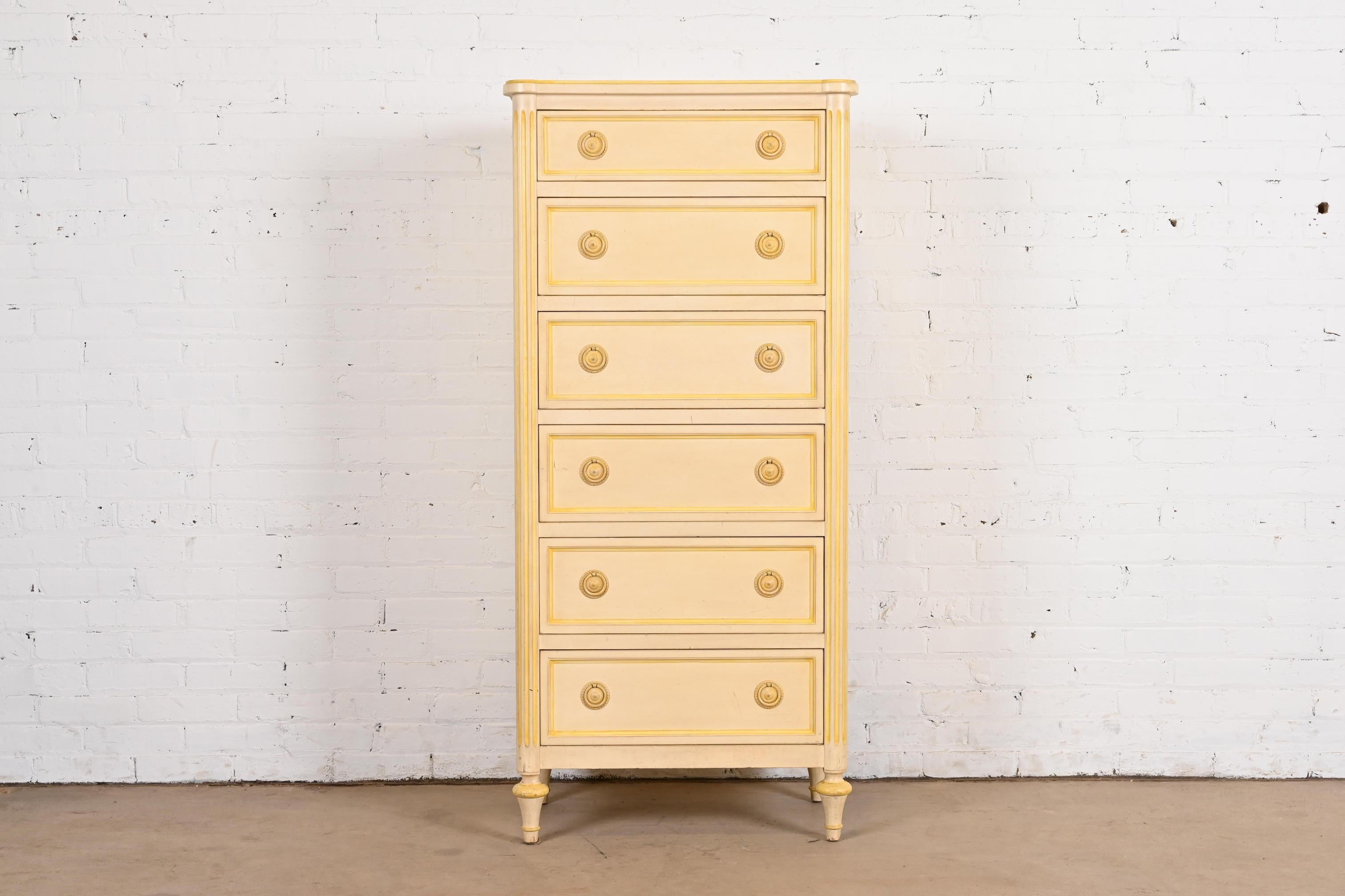 A gorgeous French Regency Louis XVI style six-drawer semainier or lingerie chest

By Jacques Bodart

USA, Circa 1960s

Cream painted carved walnut, with yellow painted trim, and original painted brass hardware.

Measures: 26.25
