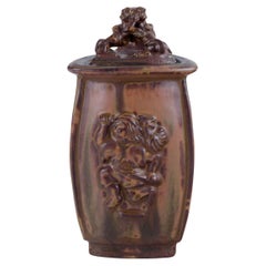 Bode Willumsen for Royal Copenhagen. Lidded jar made of sung glazed earthenware.