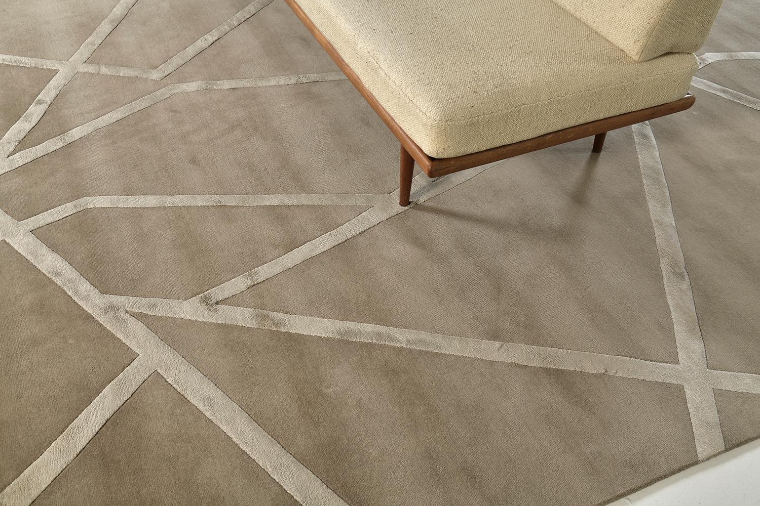 'Bodhi Bar' is an abstract piece that is made up of wool and embossed silk detailing. It is a part of our Design Rhymes Collection which pulls inspiration from different forms of architecture. The fine lines and sharp edges moving through the rug