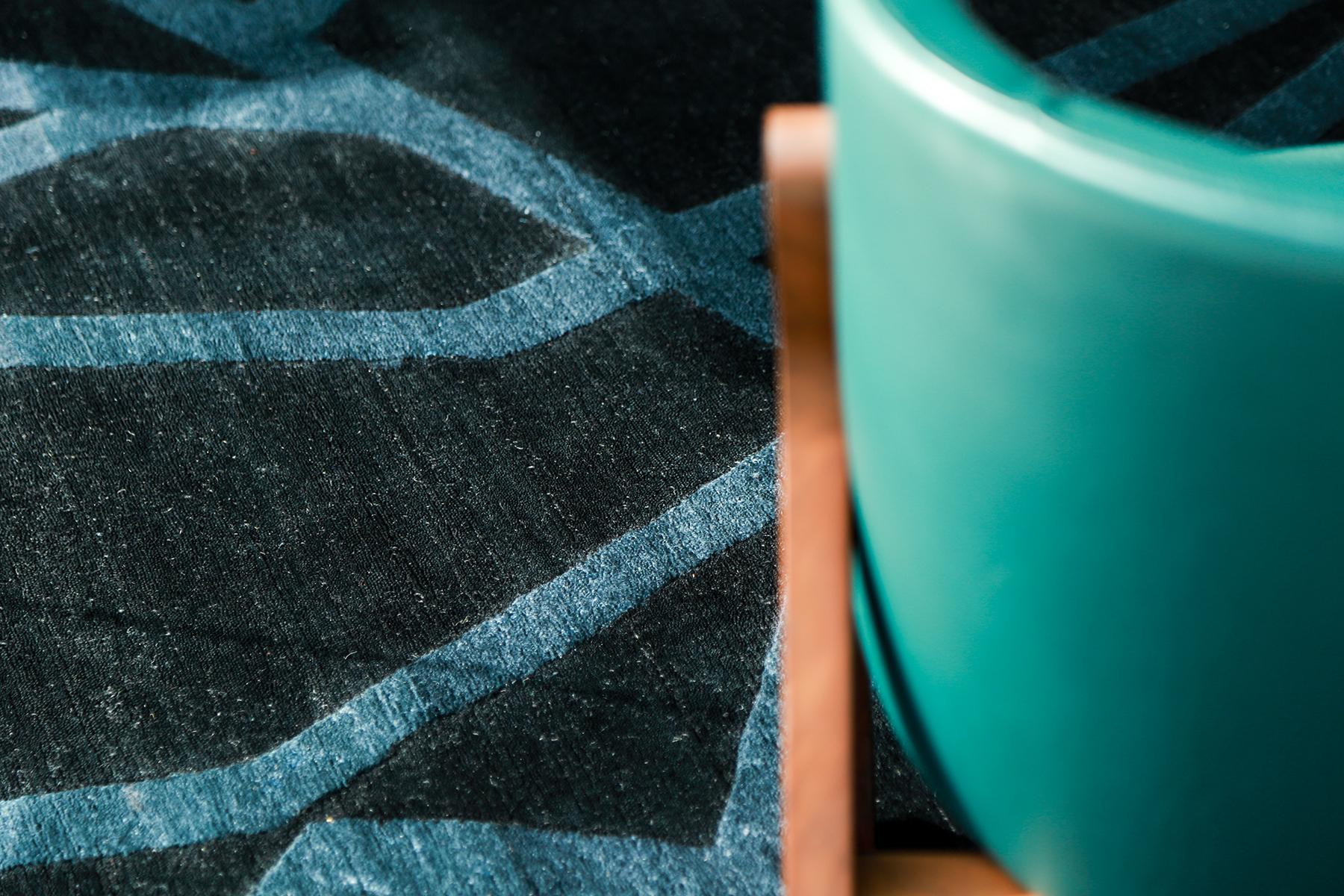 Bodhi Bar is an abstract piece that is made up of wool with embossed silk detailing. It is a part of our Design Rhymes Collection which pulls inspiration from different forms of architecture. These Fine lines and sharp edges moving through the rug