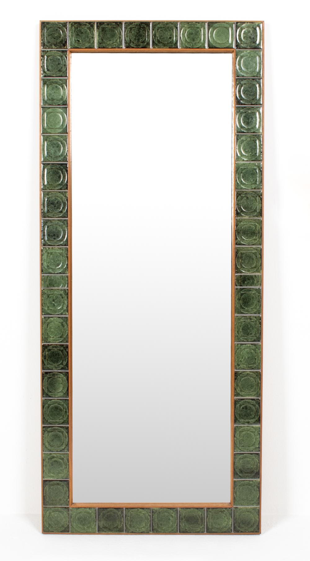 A stunning Danish mid-century wall mirror with a matching shelf in blonde oak wood, both with gorgeous sea-toned green flecked and impressed ceramic tiles, in the manner of Danish designer Bodil Eje (1931 - 2006). A fabulous way to coordinate a