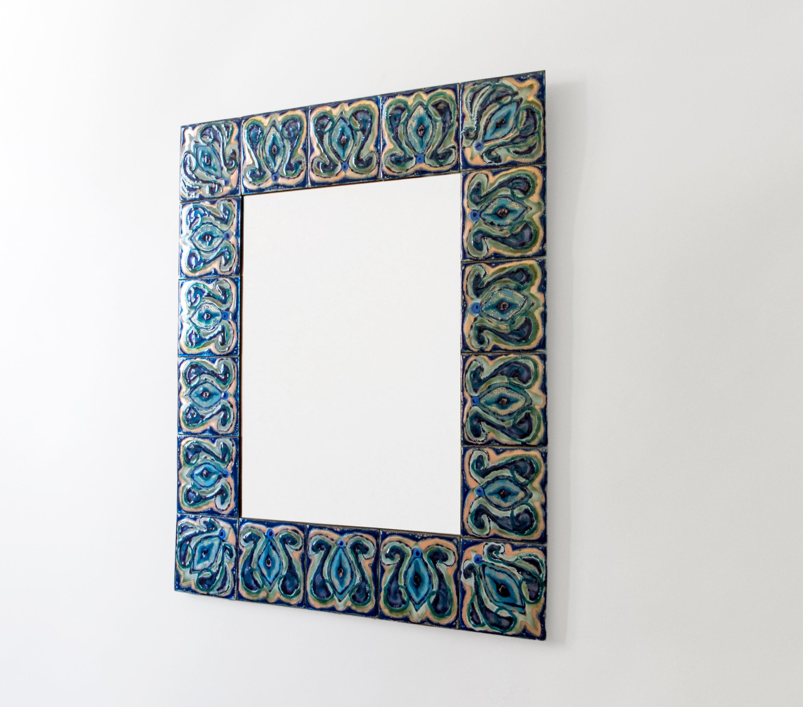 Composed of enameled plates hand-painted by Danish artist Bodil Eje. The repeating pattern displays richly variegated cobalt blue, evergreen, seafoam green, and colorless enamel exposing the copper undersurface, surrounding a colorless rectangular