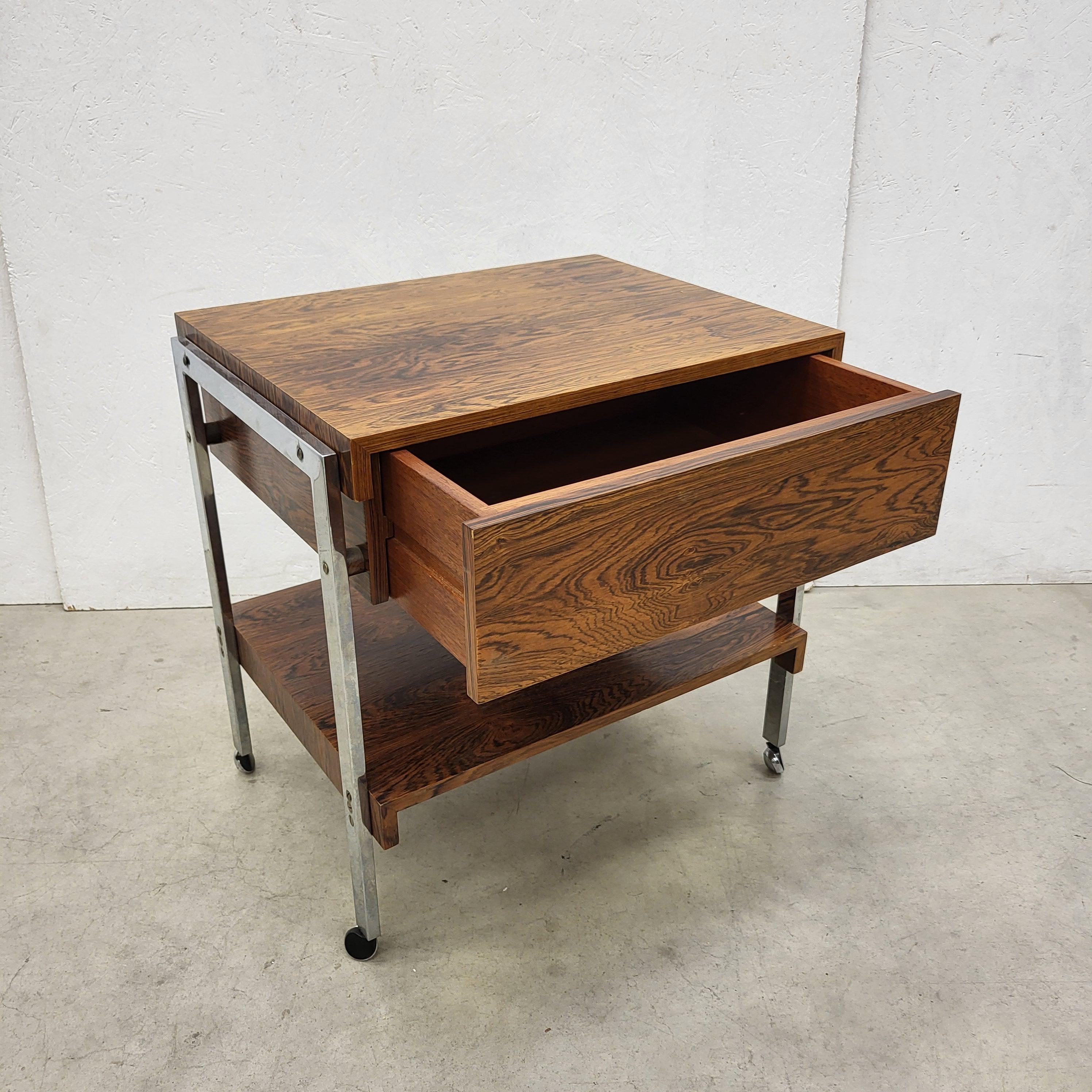 Rare midcentury cabinet trolley by Bodil Kjaer for E. Pederson Son.
Designed in 1959 and made in Denmark in a very low production line in the late 50s, early 60s.

Impressive veneer & wood structure. Stunning piece!
Reduced design made with highest