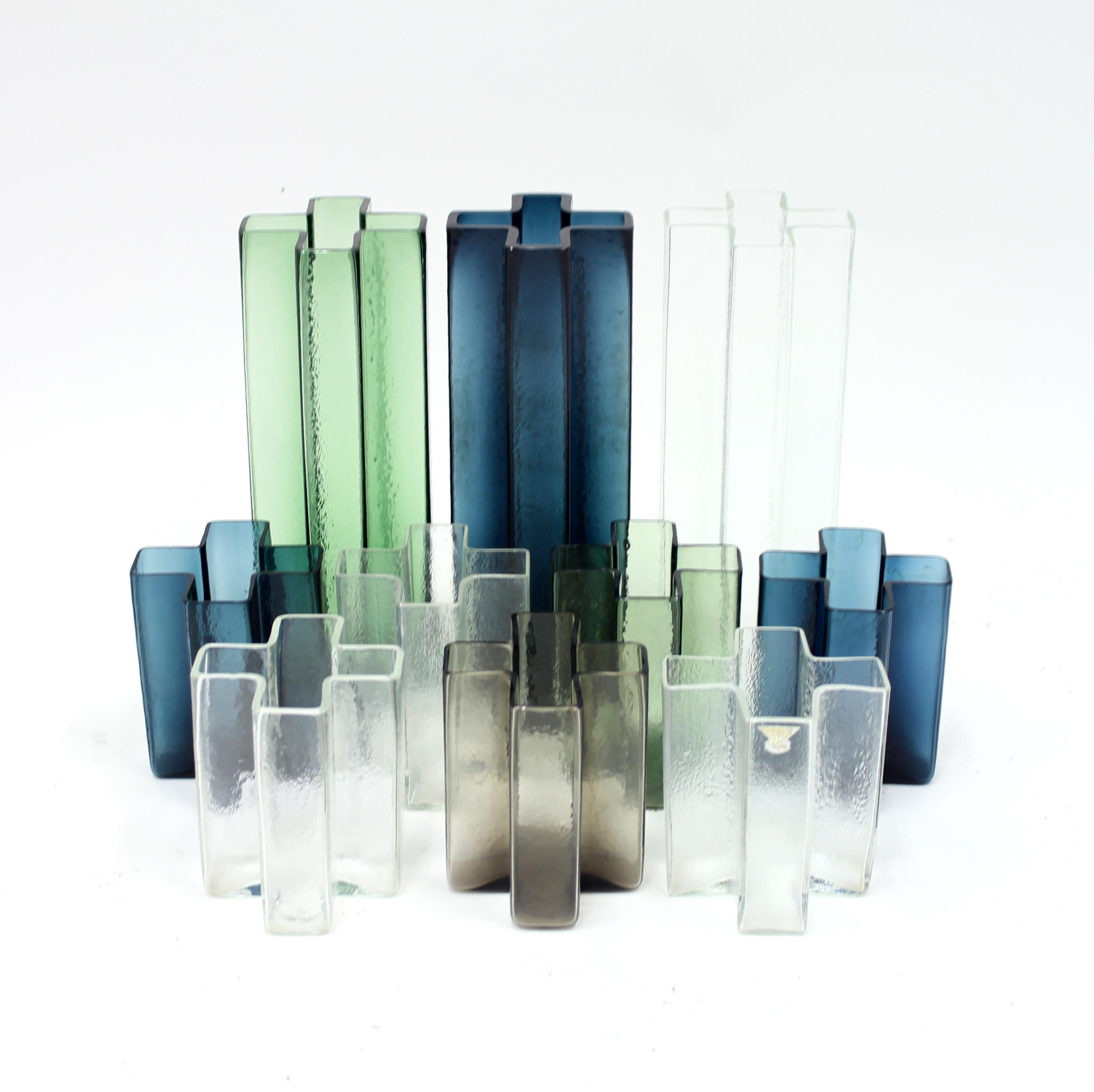 Rare large set of 10 Cross vases designed by Danish designer Bodil Kjaer for Swedish manufacturer Gullaskruf in the 1960s. The set contains of two sizes, the largest measuring 27 cm in height and the smallest 12 cm. One of the small vases has the