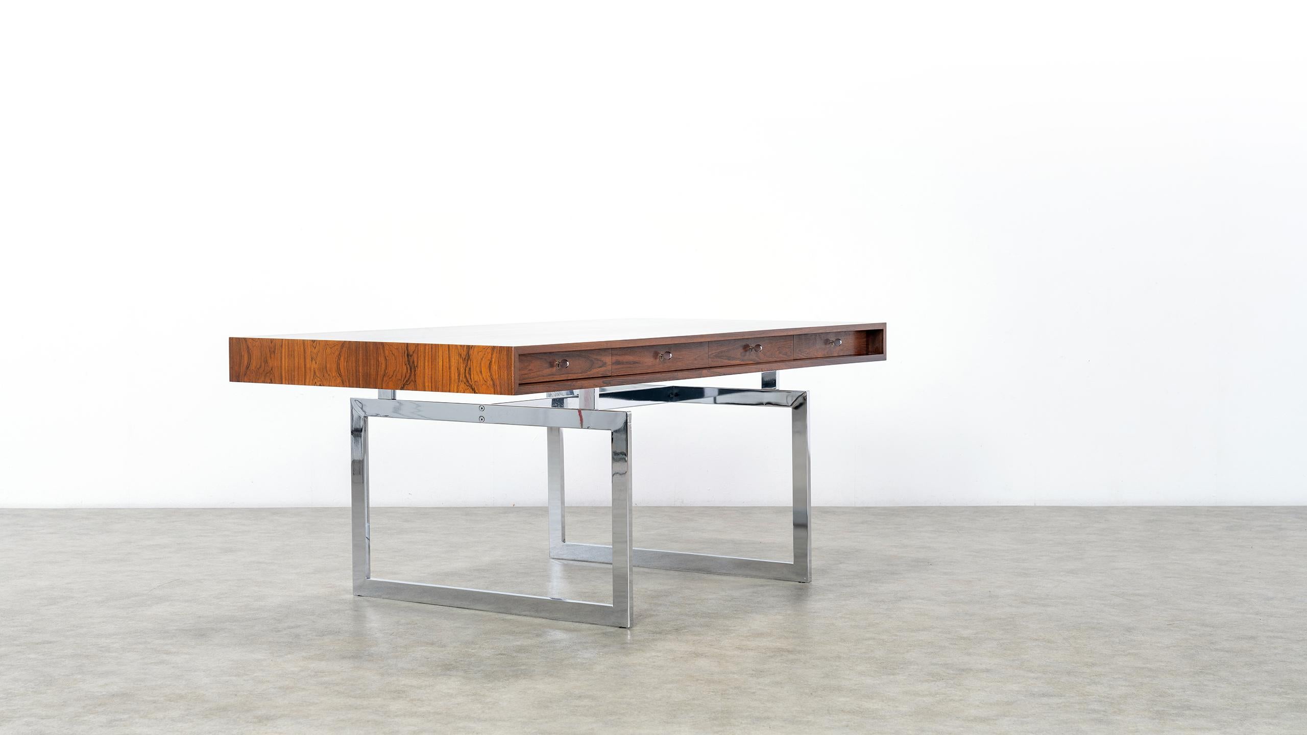 Bodil Kjaer for E. Pedersen & Søn, table model 901, 
certified Rio Rosewood and chrome steel, Denmark, 1959, completely restored.

An exceptionally beautiful version, the veneer shows an absolutely stunning pattern. Metalbase in good
